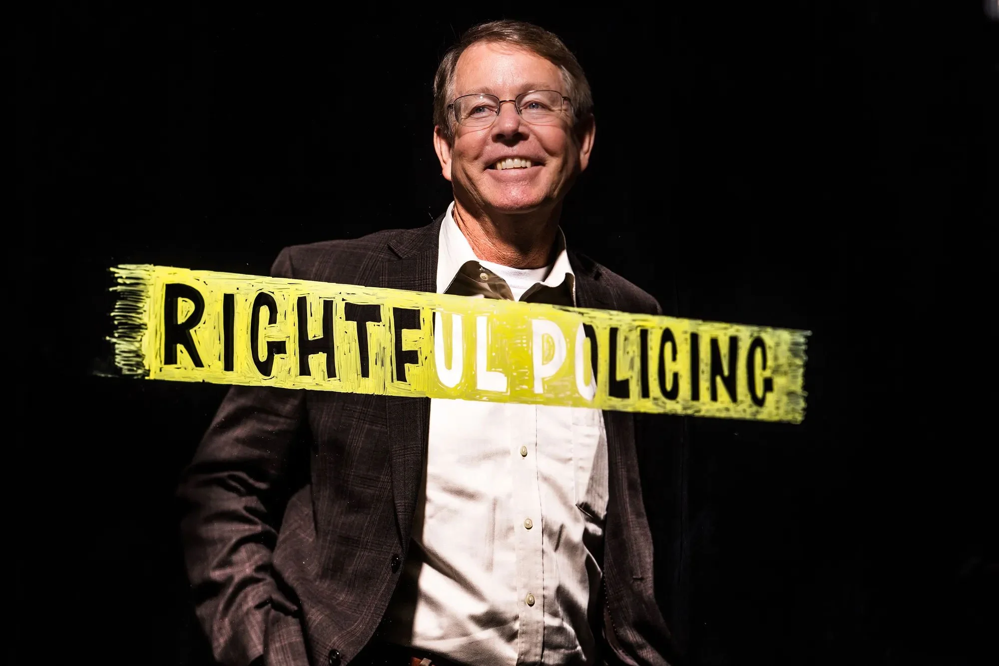 Jim Bueerman with yellow banner, “Right Policing"