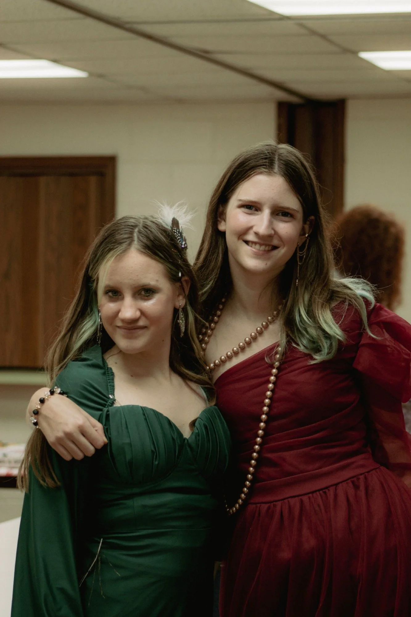 Two students dressed up in formal costumes for the Clue-themed Late Night