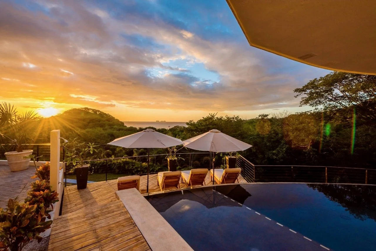 The deck and lounge pool at sunset