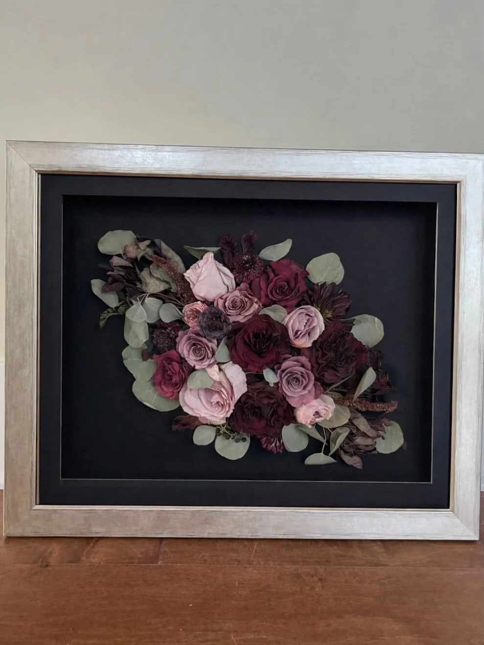 I absolutely love the more eclectic designs, which are rising in popularity! With the black backdrop, gold frame and moody deep colors, this style seems to mesh seamlessly. 

Don&rsquo;t forget to check out our design page for inspiration! There are 