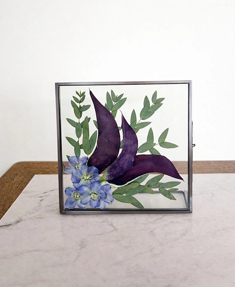 A mini glass display with wedding flowers in Florida