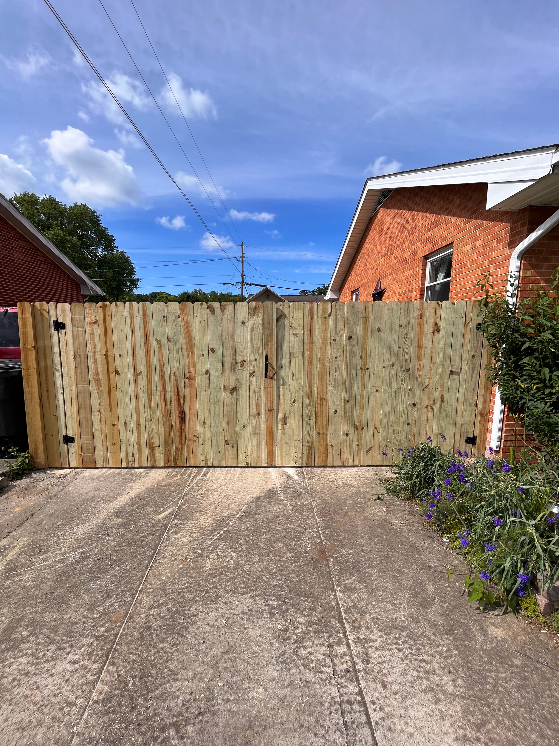 Wooden privacy fence with double gate