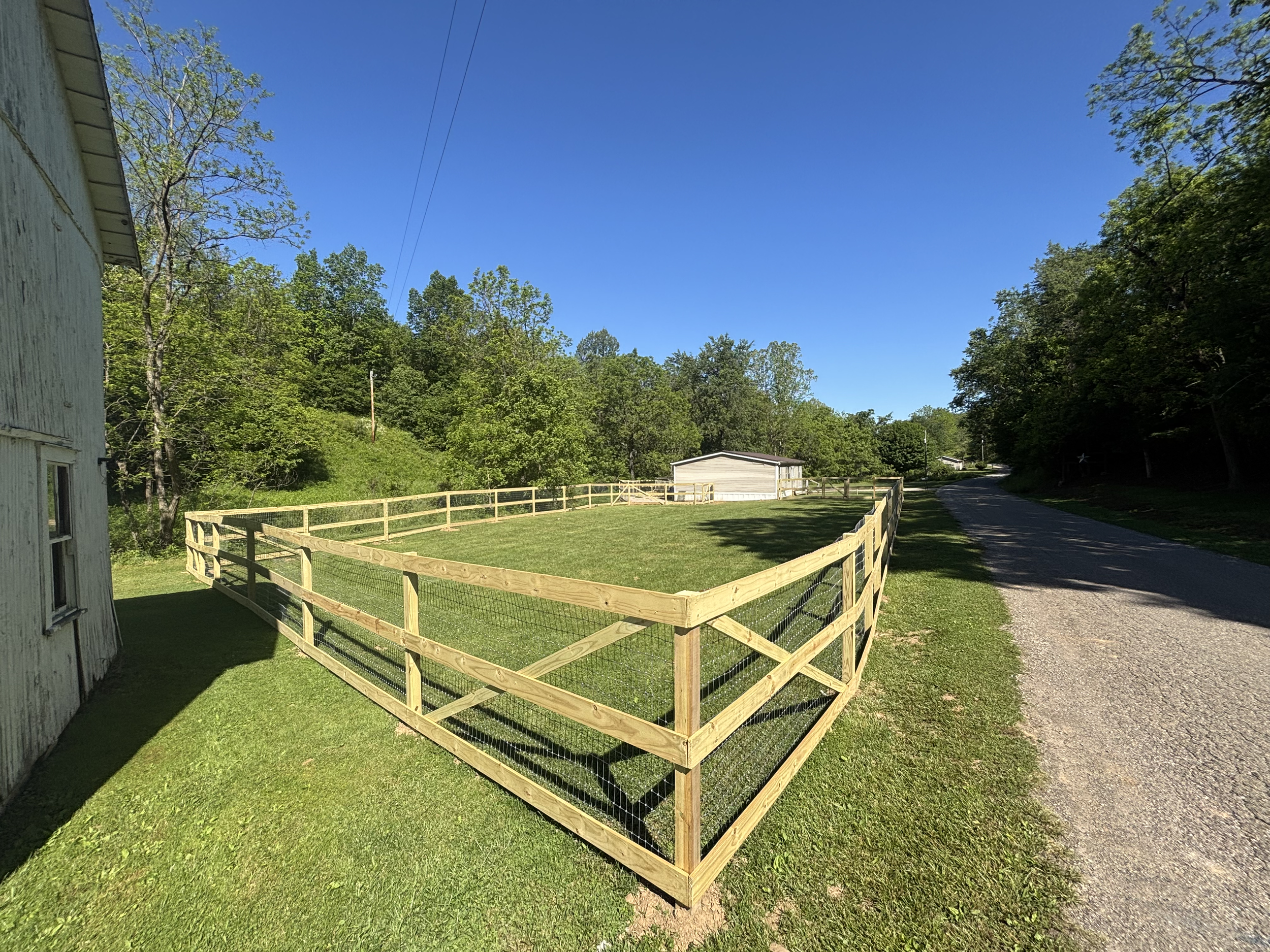 three board horse fence with woven wire for livestock