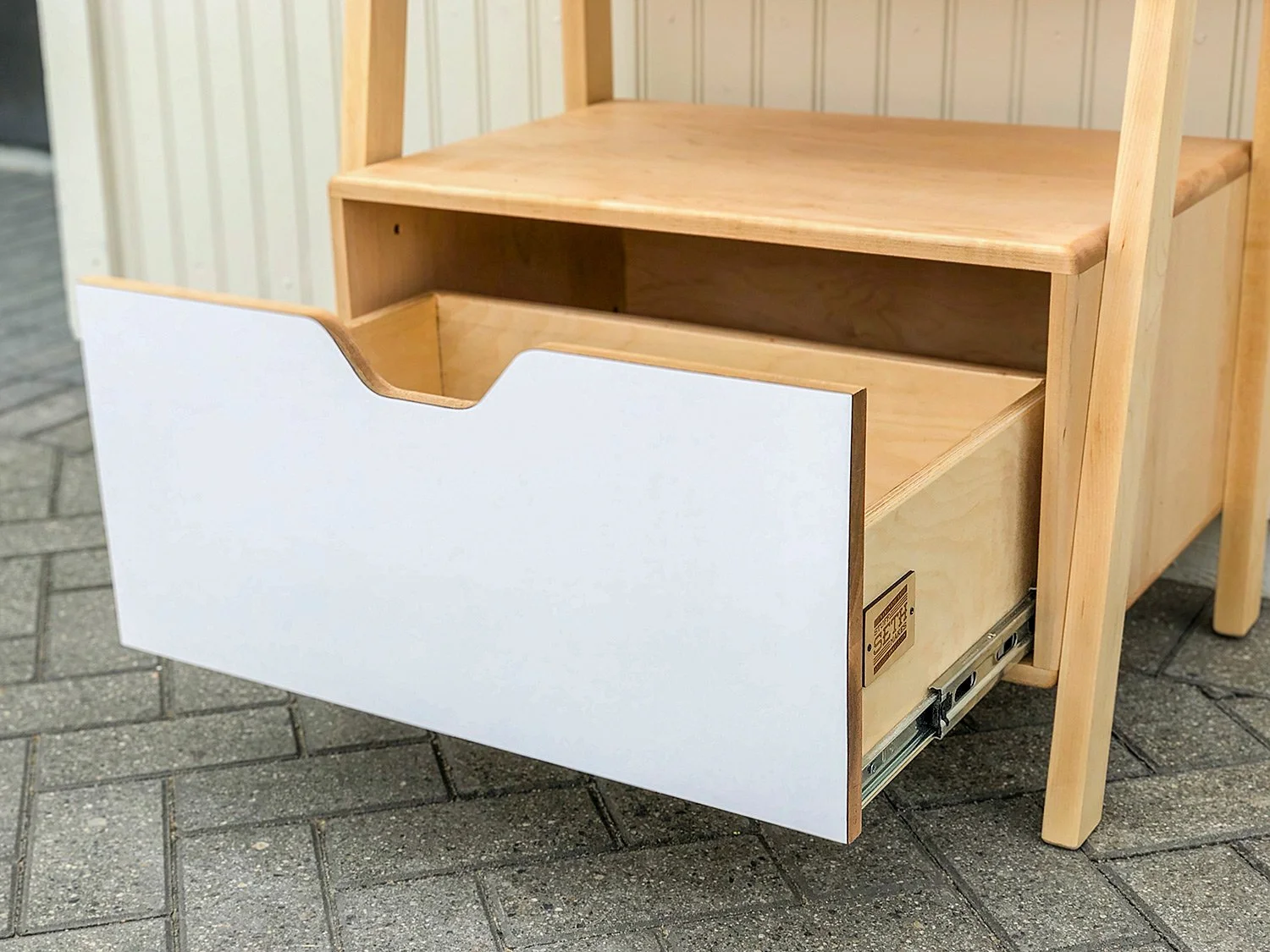 Retail shelf unit made from maple with formica accent