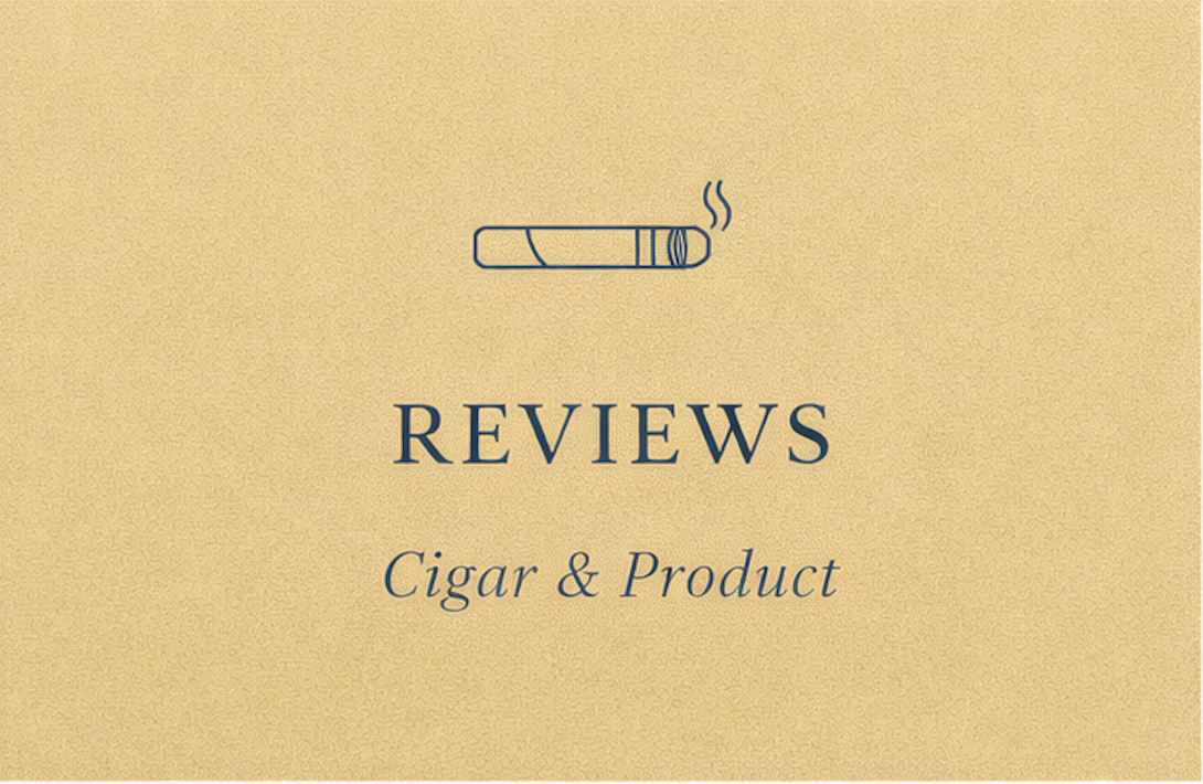 A small white skull figurine on a wooden surface with an ashtray and a cigar, in a dimly lit setting.