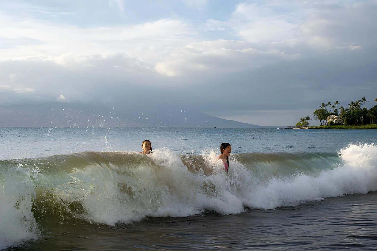 Surfing waves on Maui coastline