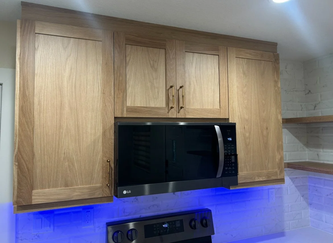 Natural oak hardwood and black shaker mixed-finish kitchen