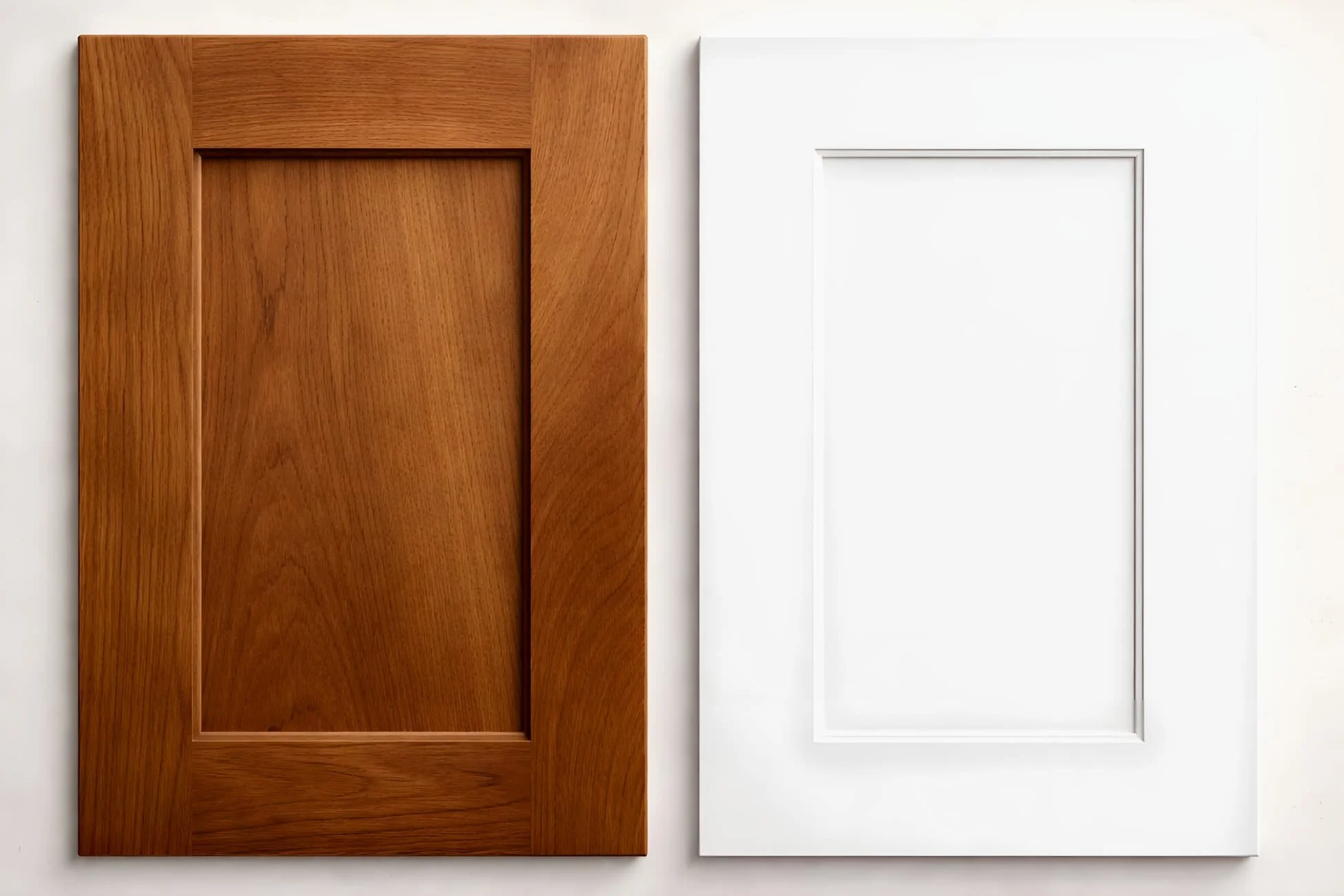 Comparison of hardwood and paint-grade shaker cabinet doors showing finish and material differences