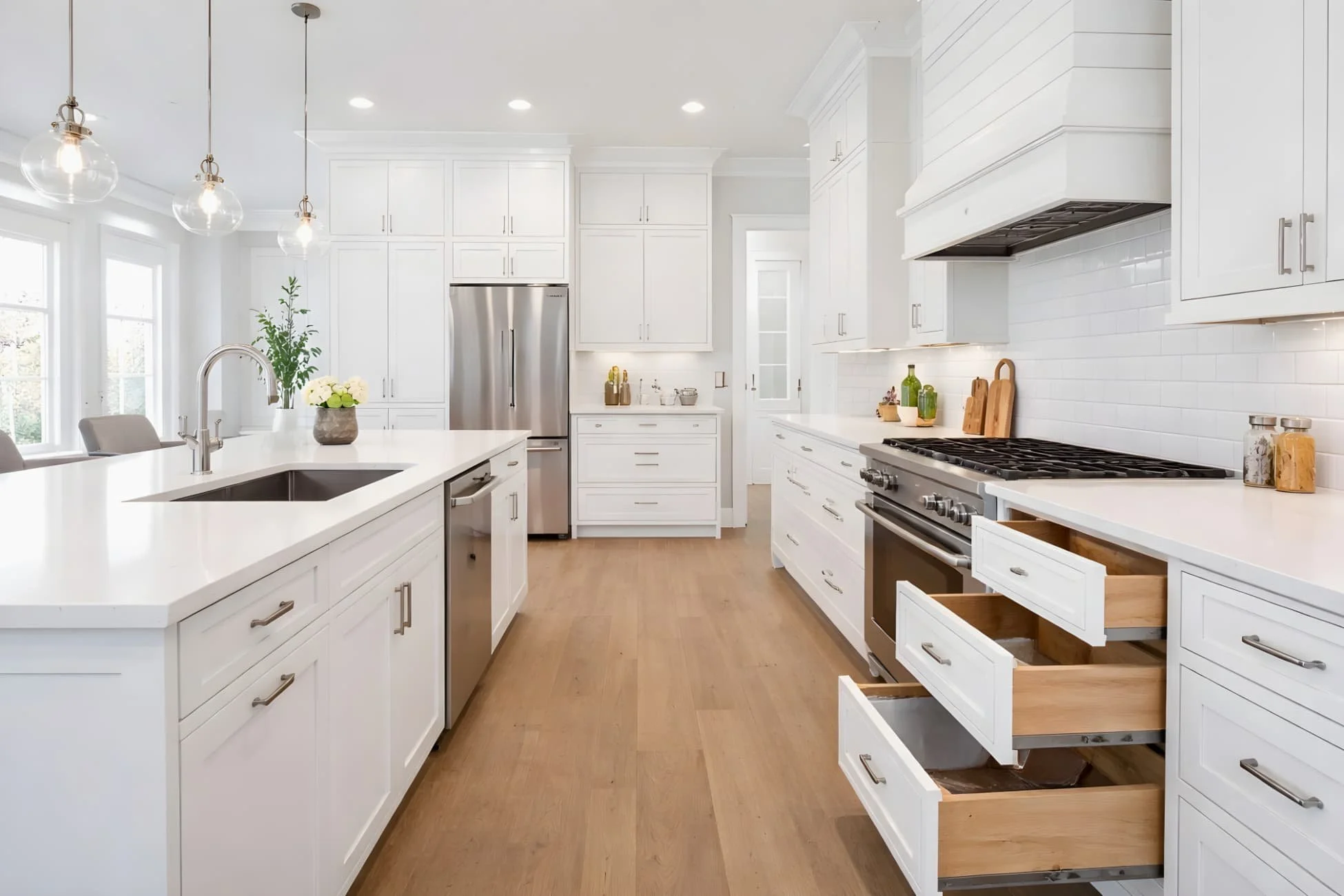 Premium white shaker kitchen cabinetry with full-extension drawers and soft-close hardware