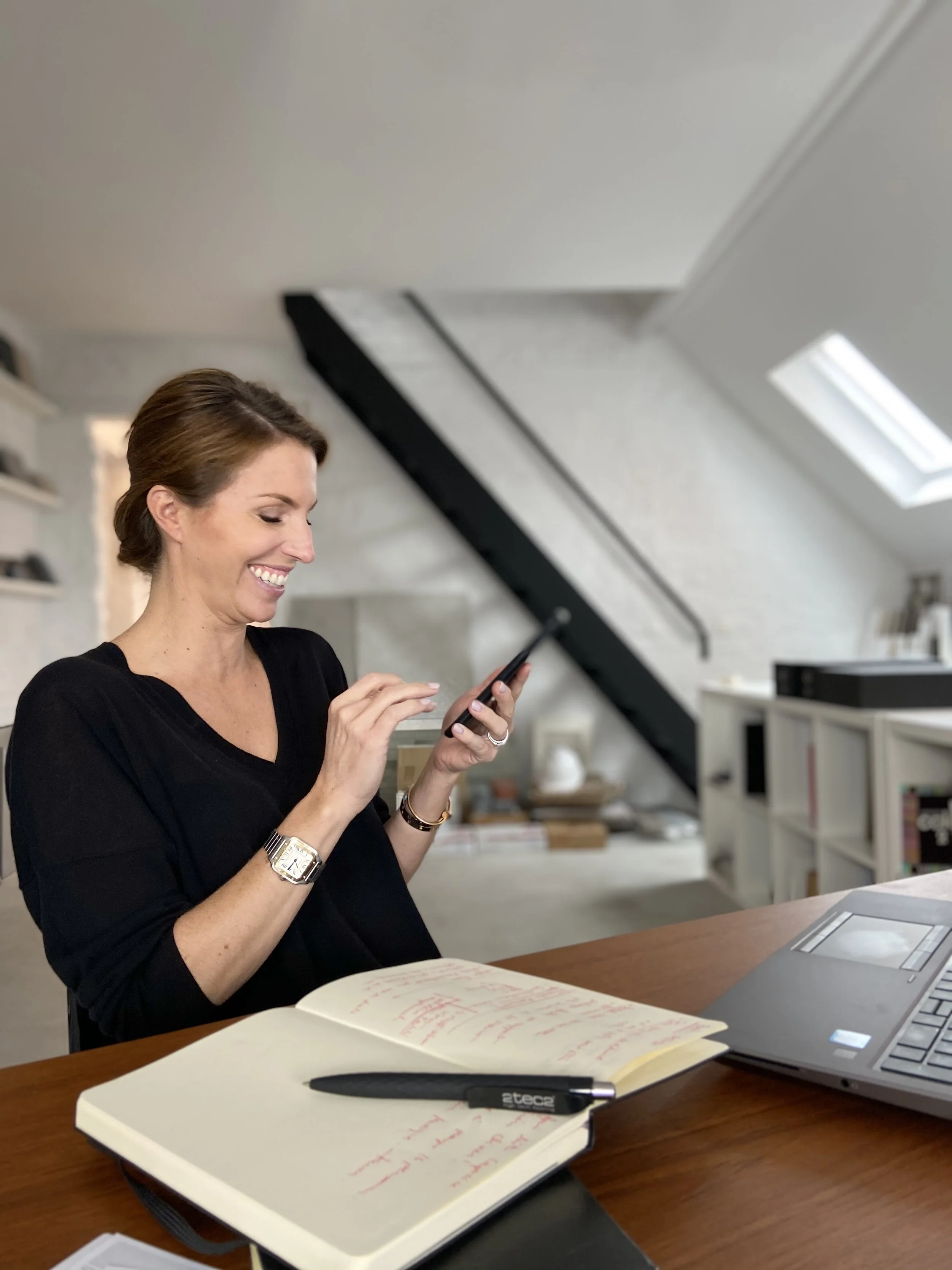 Architect Julie Palma Engels at her desk with her HP ZBook laptop
