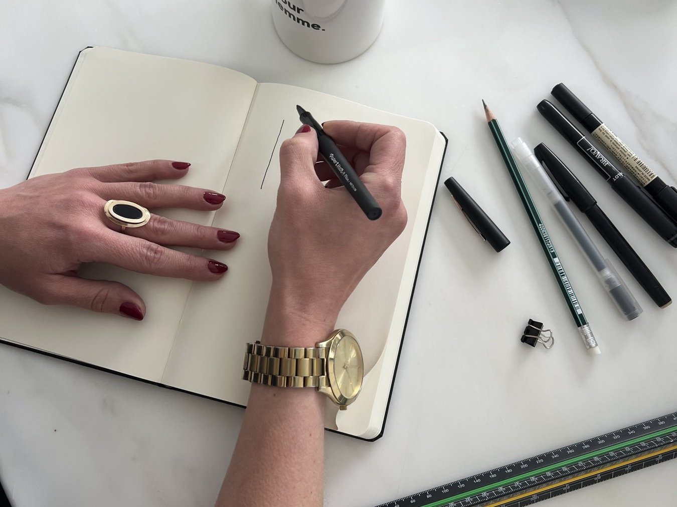 Architecture student planning the week in a sketchbook to reduce stress