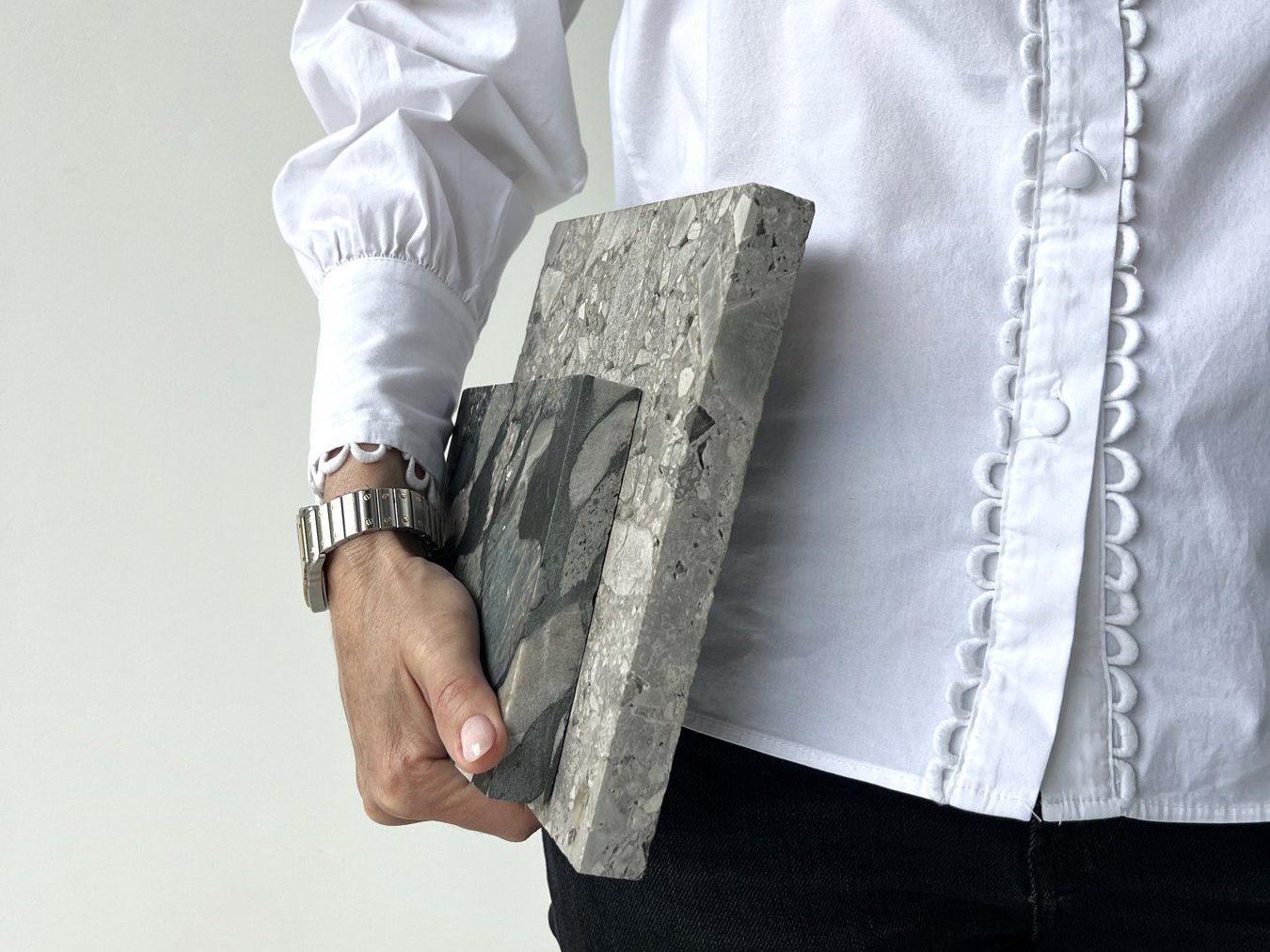 Architect holding stone material samples, a calm way to make design decisions