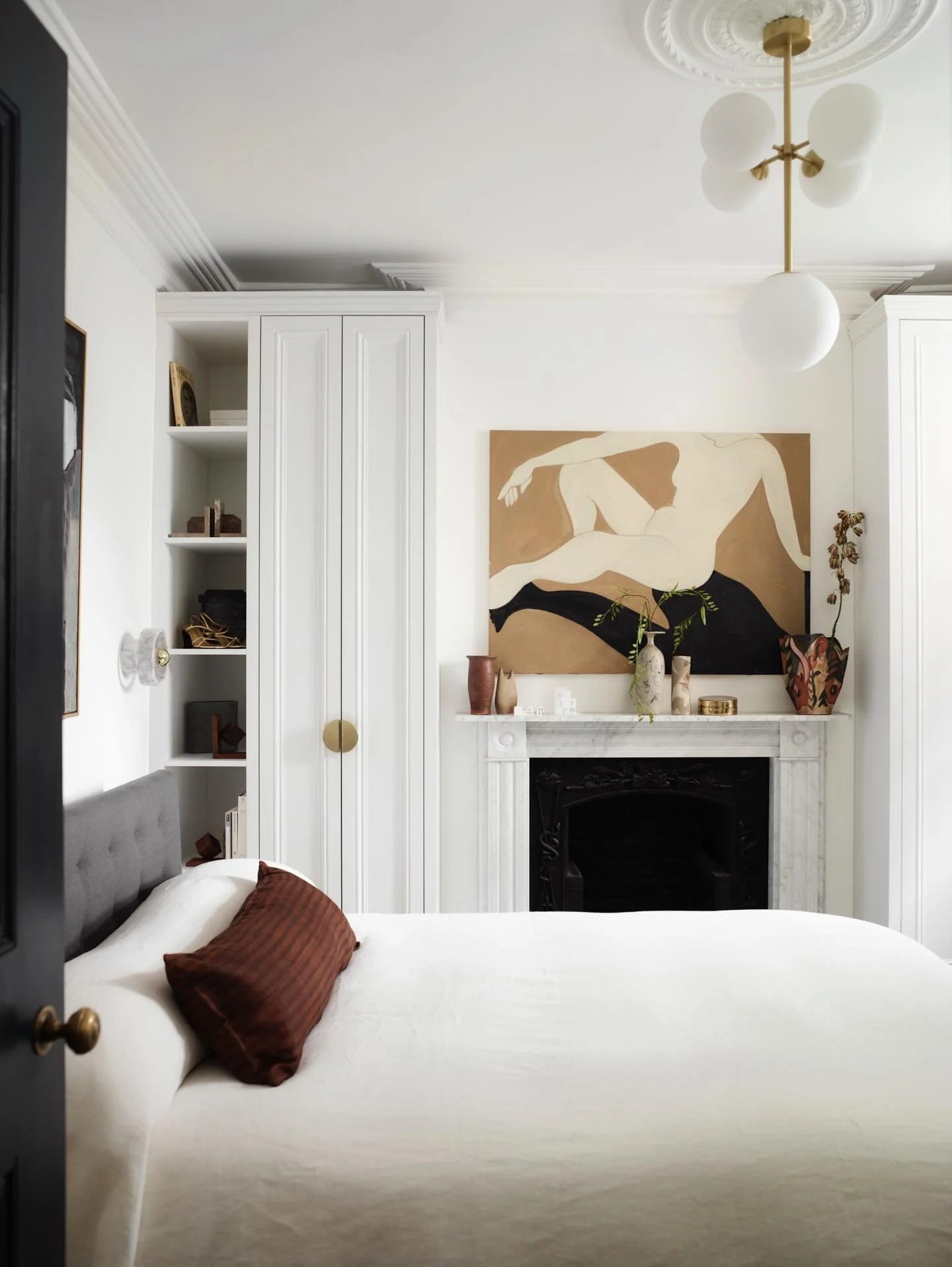 The principal bedroom in our Grade II listed Georgian townhouse. Before and after.
The room was strangely bare with all architectural features apart from the cast iron fireplace inset and the arched window had been removed. We carefully sourced detai