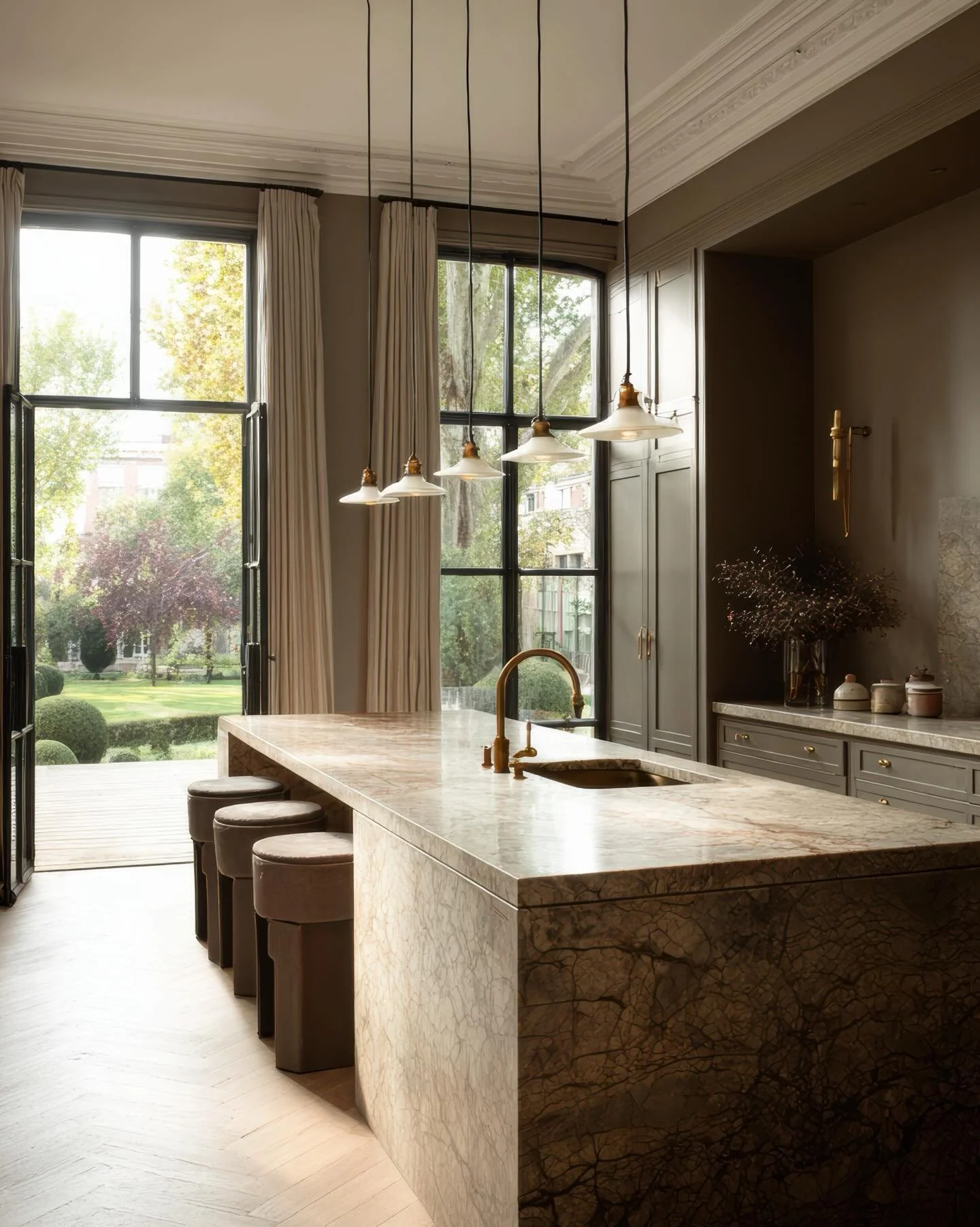 While we love a crisp, white, light filled kitchen, there are moments where a warmer, moodier palette feels exactly right.

Here, deeper tones, natural stone and soft brass details create a sense of calm and depth that suits the character of the hous