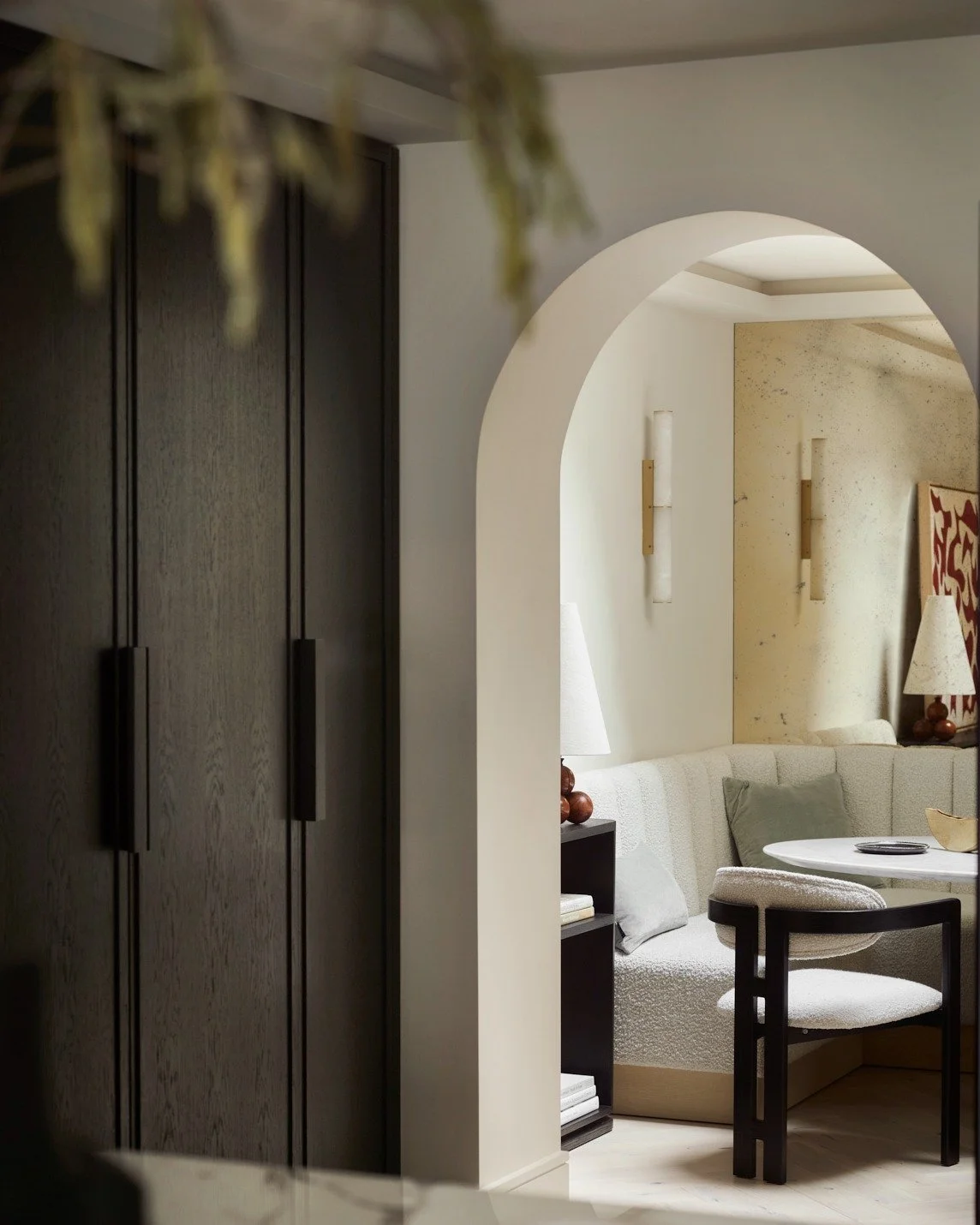 In houses with limited space, it&rsquo;s often the transitions that do the hardest work.

This view looks through the kitchen to the dining room at Chelsea Arches House. Rather than relying on decoration, the change between spaces is defined architec