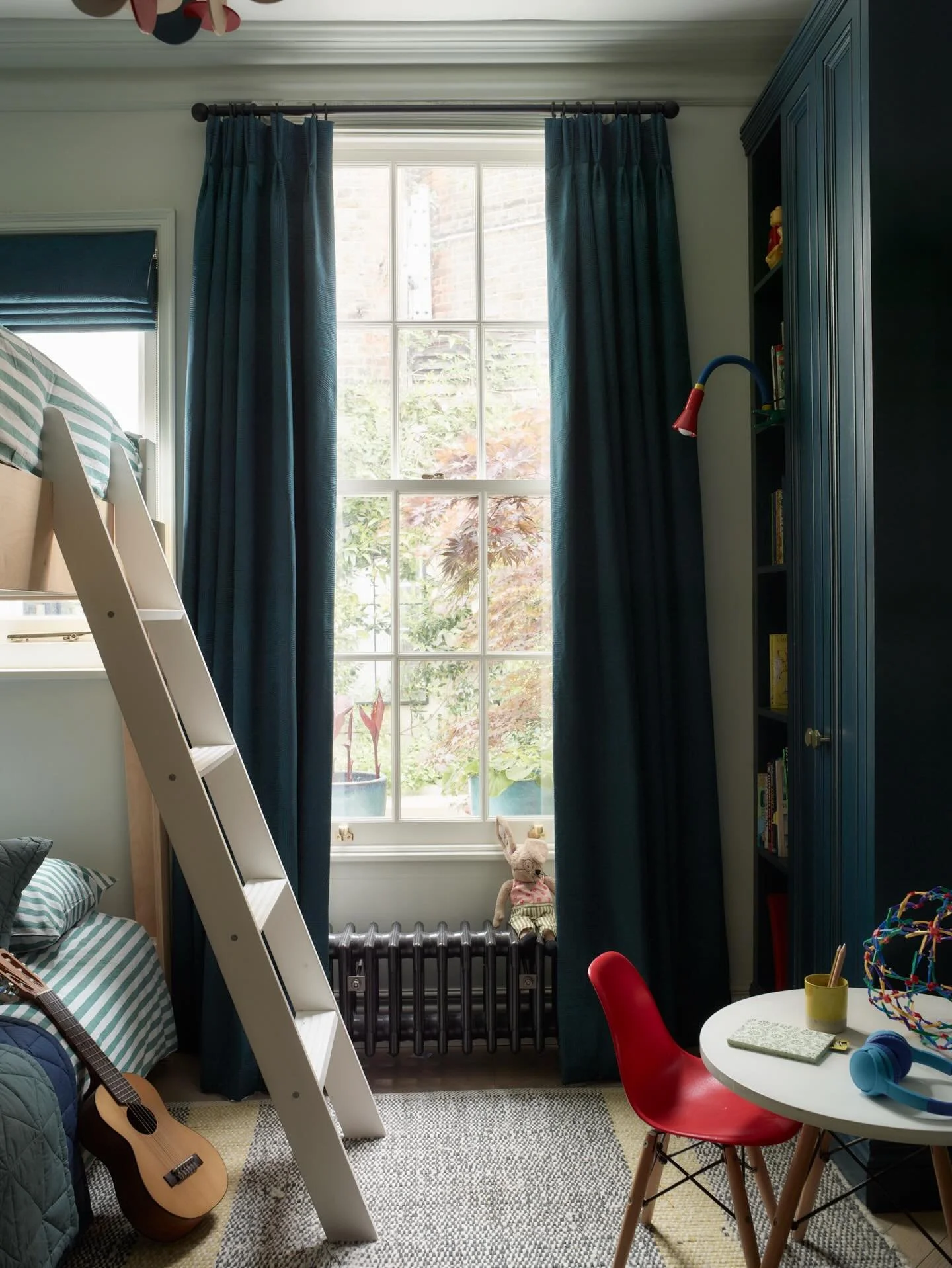 Shared bedrooms for siblings need to work hard. They have to accommodate sleep, play, reading, making and the constant churn of toys and hobbies, all within the footprint of a Georgian London townhouse where existing features like fireplaces &amp; wi