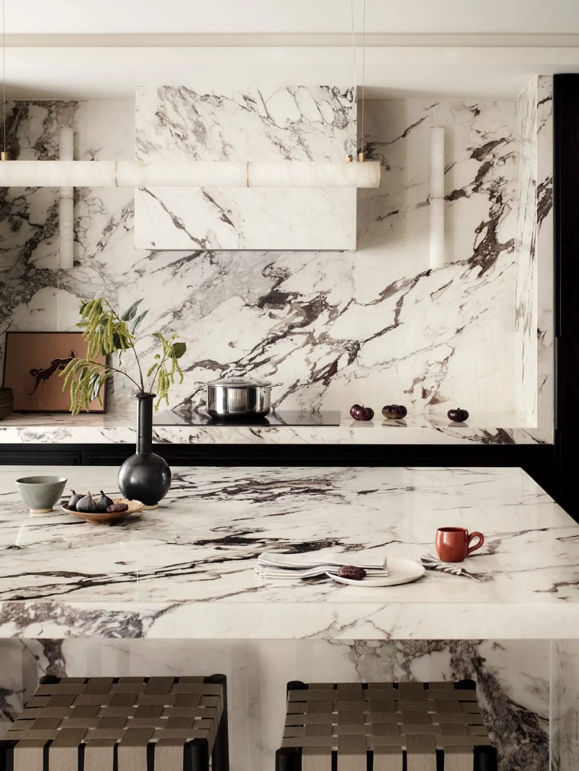 The heart of the kitchen in our Chelsea Arches mews house. A generous marble clad island, ideal for a morning coffee or entertaining in the evening. Fun fact, it&rsquo;s actually a high quality porcelain that means you can spill champagne, put hot po