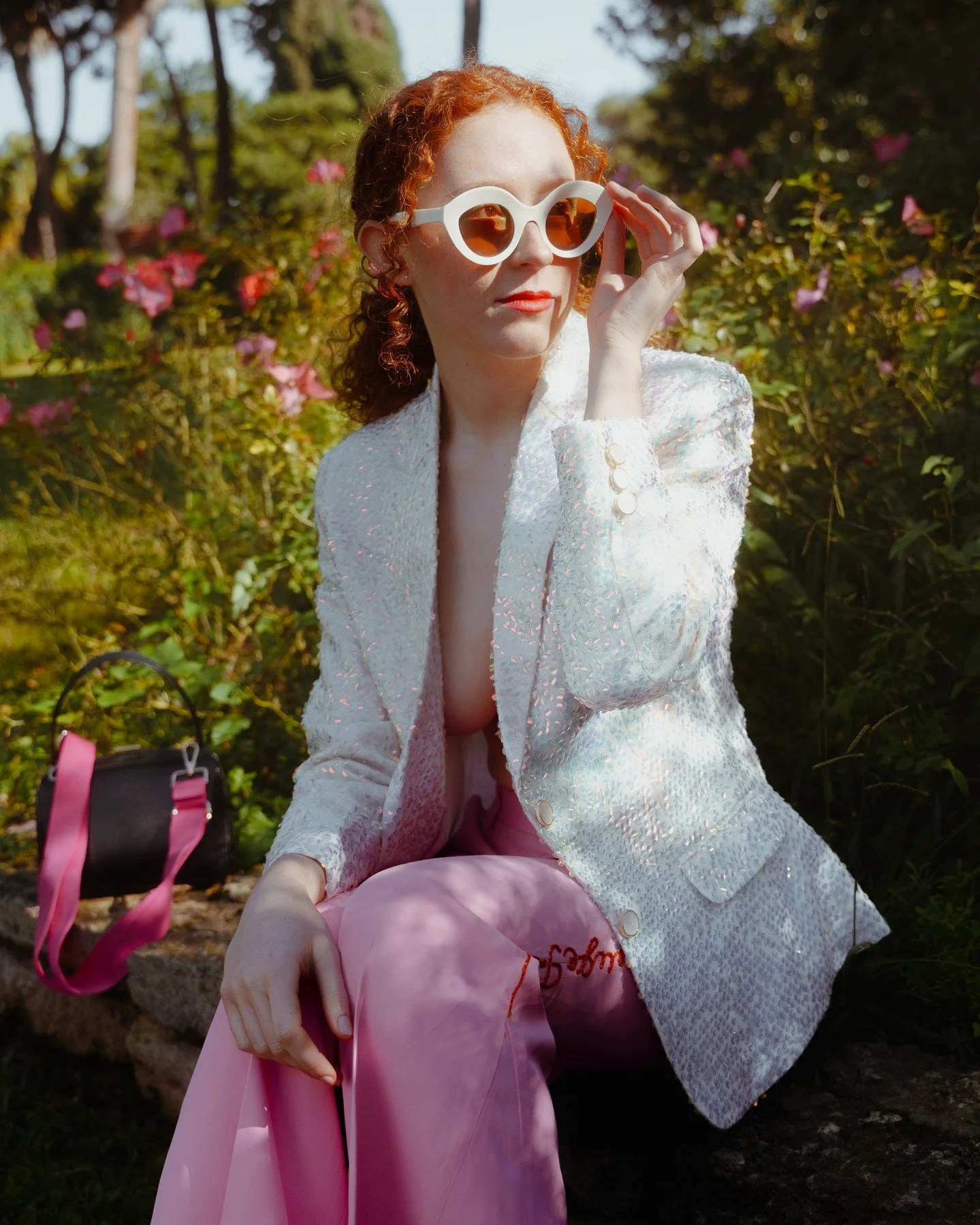 Style is a silent language, and hers speaks of dominance. This chapter is dedicated to the queen who creates her own opportunities and her own luck. This shot captures the fusion of ancient textile art and the modern, executive, and feminine energy.
