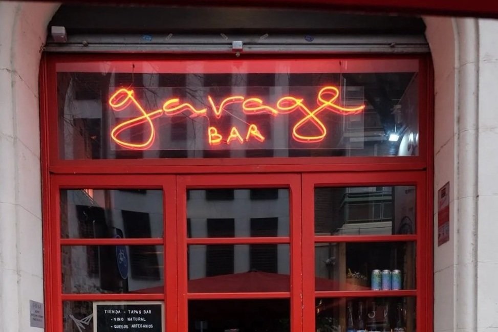  Garage Bar   

  Tapas bar with classic and natural wines set in a moody, industrial space.  


   J : Make sure to check out the interesting bottles for purchase in the back.  

   P : Perfect place to stop for a few glasses of wine and a bite to e