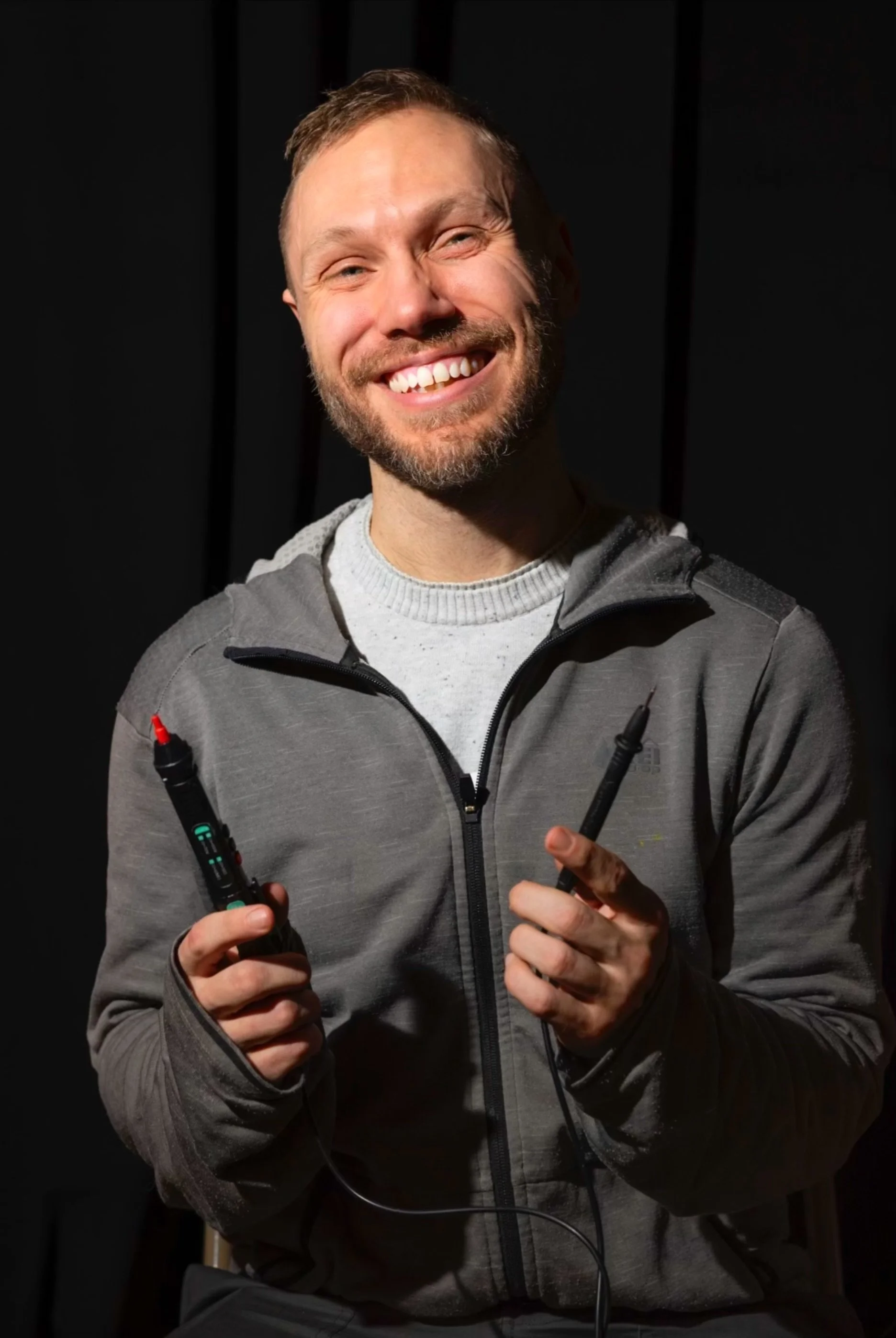 Jay Jeschke Repair Coach at Repair Cafe El Barrio holding a tool