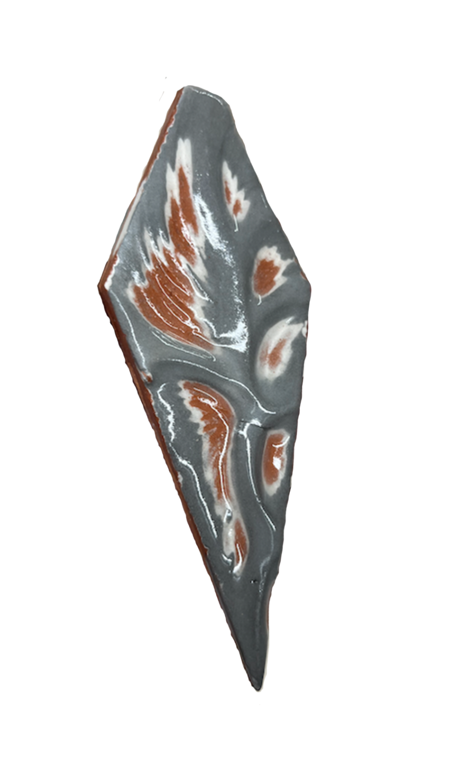 A layered, marbled soap with gray, white, and reddish-brown swirled patterns.