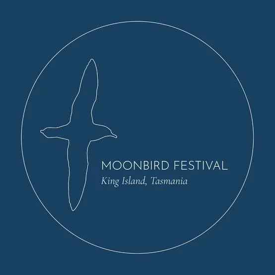 Logo for Moonbird Festival featuring a white outline of a moonbird within a circle on a dark blue background, with text indicating the event is on King Island, Tasmania.