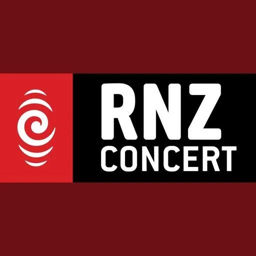 Logo for RNZ Concert with red and black background, featuring a spiral symbol on the left and the text 'RNZ CONCERT' on the right.