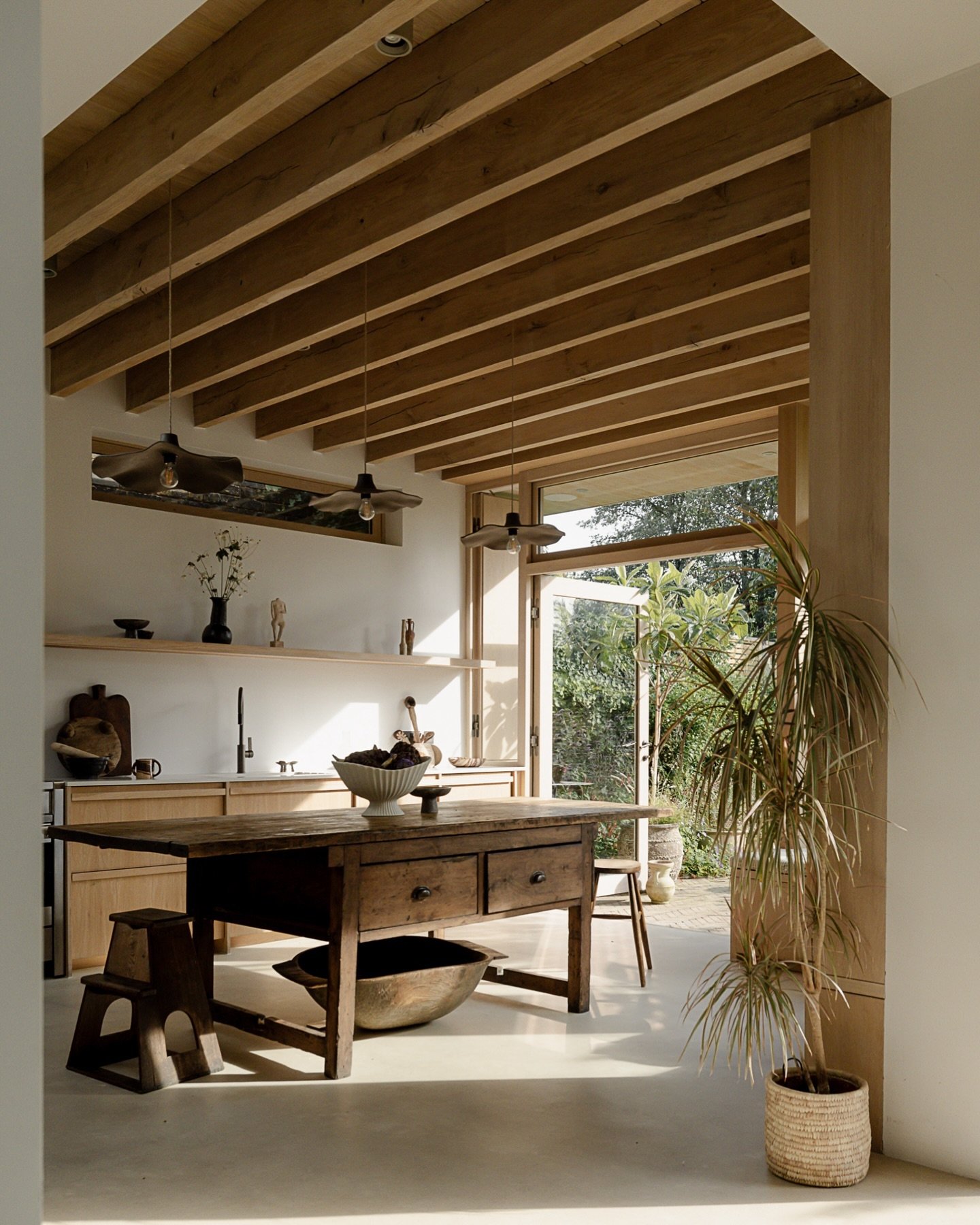 Embracing the natural light and warmth that fills this kitchen space. Exposed ceiling joists and beams can bring a greater sense of height and add visual interest by breaking up the ceiling and adding character. There&rsquo;s something grounding abou