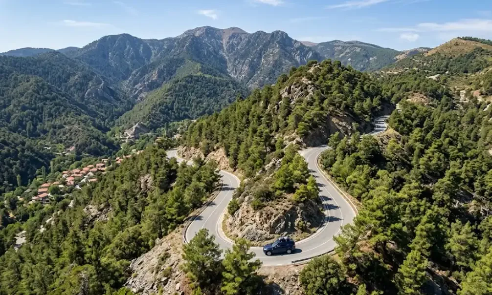 Aerial view of rental car on a mountain road in the Troodos range, Cyprus