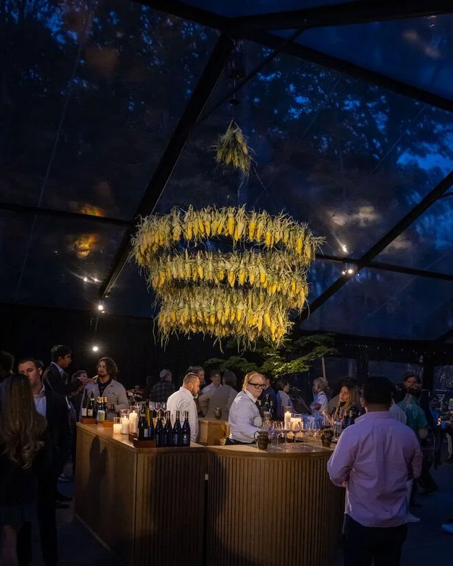 Corn-husk chandelier at blue hour