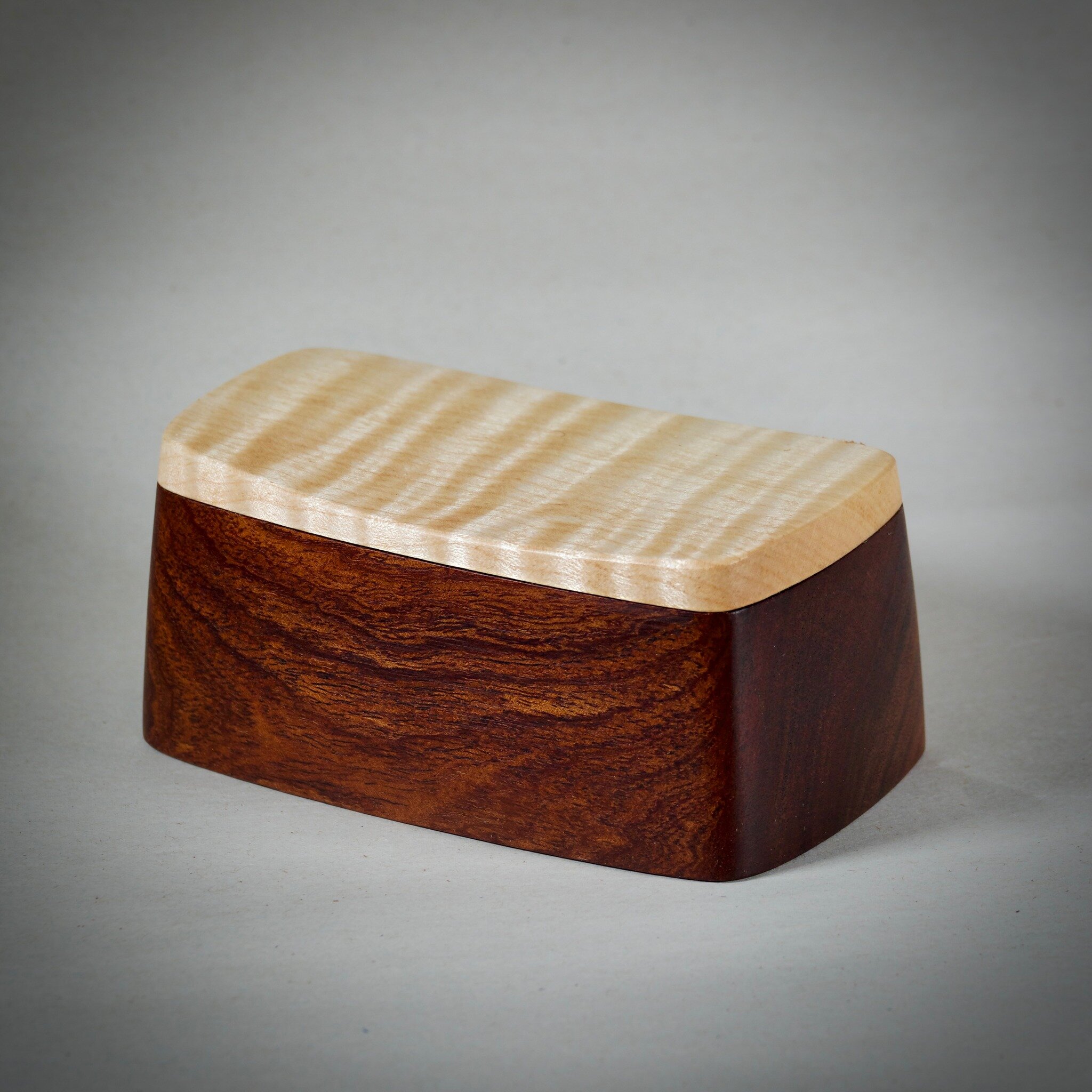 Rescued from the woodstove! These little boxes are made from local figured broadleaf maple and not so local Tasmanian Blackwood. I always struggle to find good use for stunning little offcuts like these. The boxes are only about 5&quot; long. 

It's 