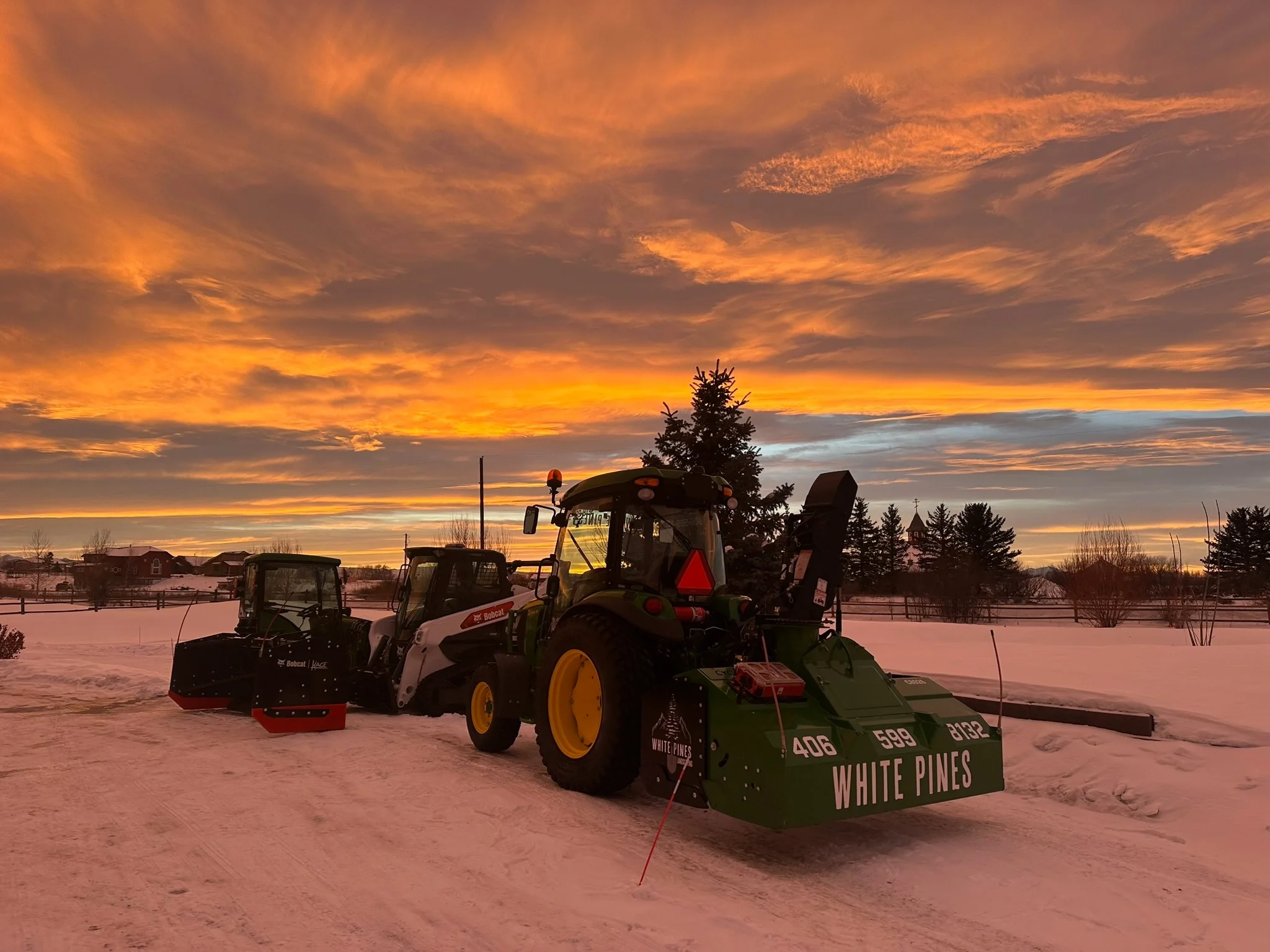 A beautiful sunset or sunrise with White Pines equipment lineup.