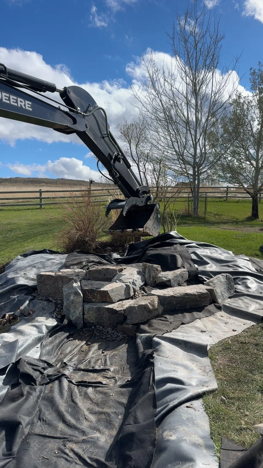 Boulders being placed strategically by White Pines near Livingston, Montana.