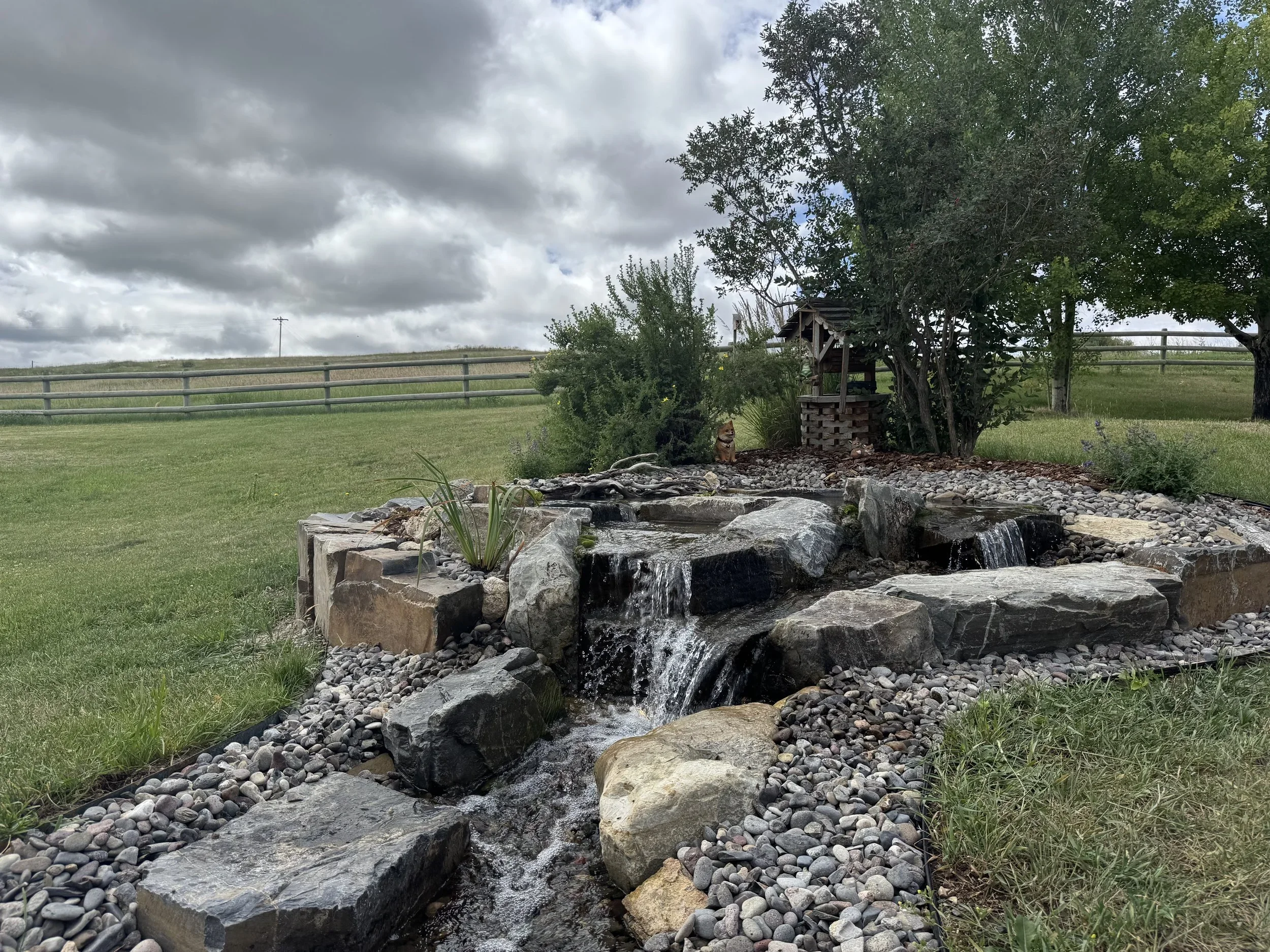 
Luxury pond-less water stream by White Pines.