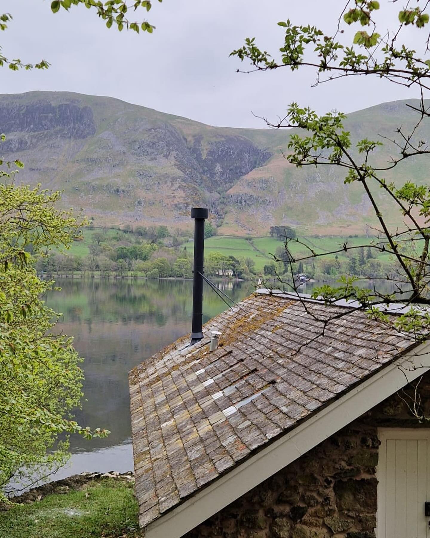 A flue with a view! 
(Caption courtesy of our installer 🤣)

Follow up to our boathouse install pics - here is the finished product. A Termatech TT20R 5kw woodburning stove set on a honed granite segmented hearth. 

#ullswater #woodburning #heating #
