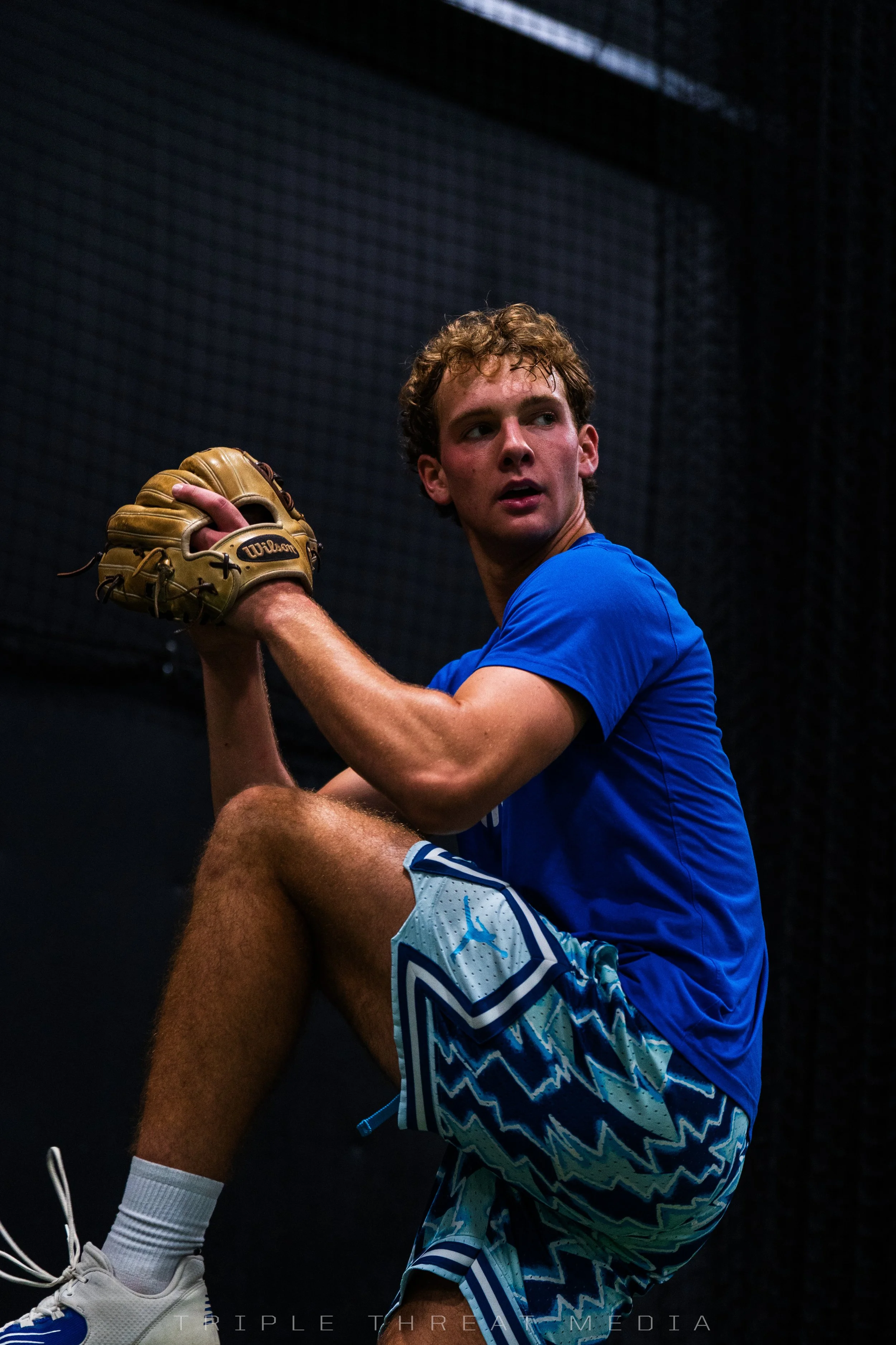Baseball pitcher at leg lift during a pitching lesson at Velocity Sports in Stark County, Ohio