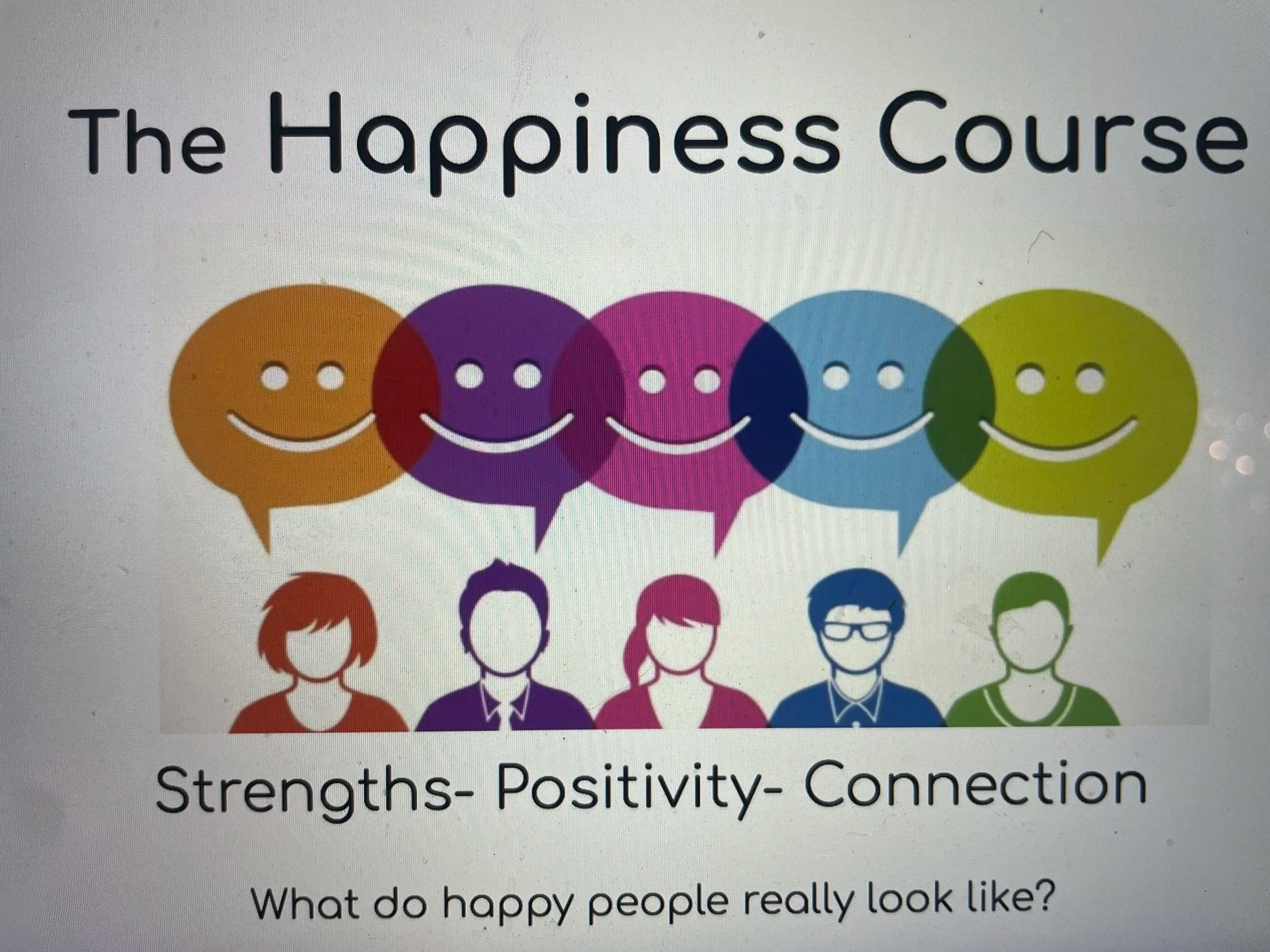Colorful speech bubbles with smiling faces above group of diverse people silhouettes, illustrating themes of happiness, positivity, and connection.