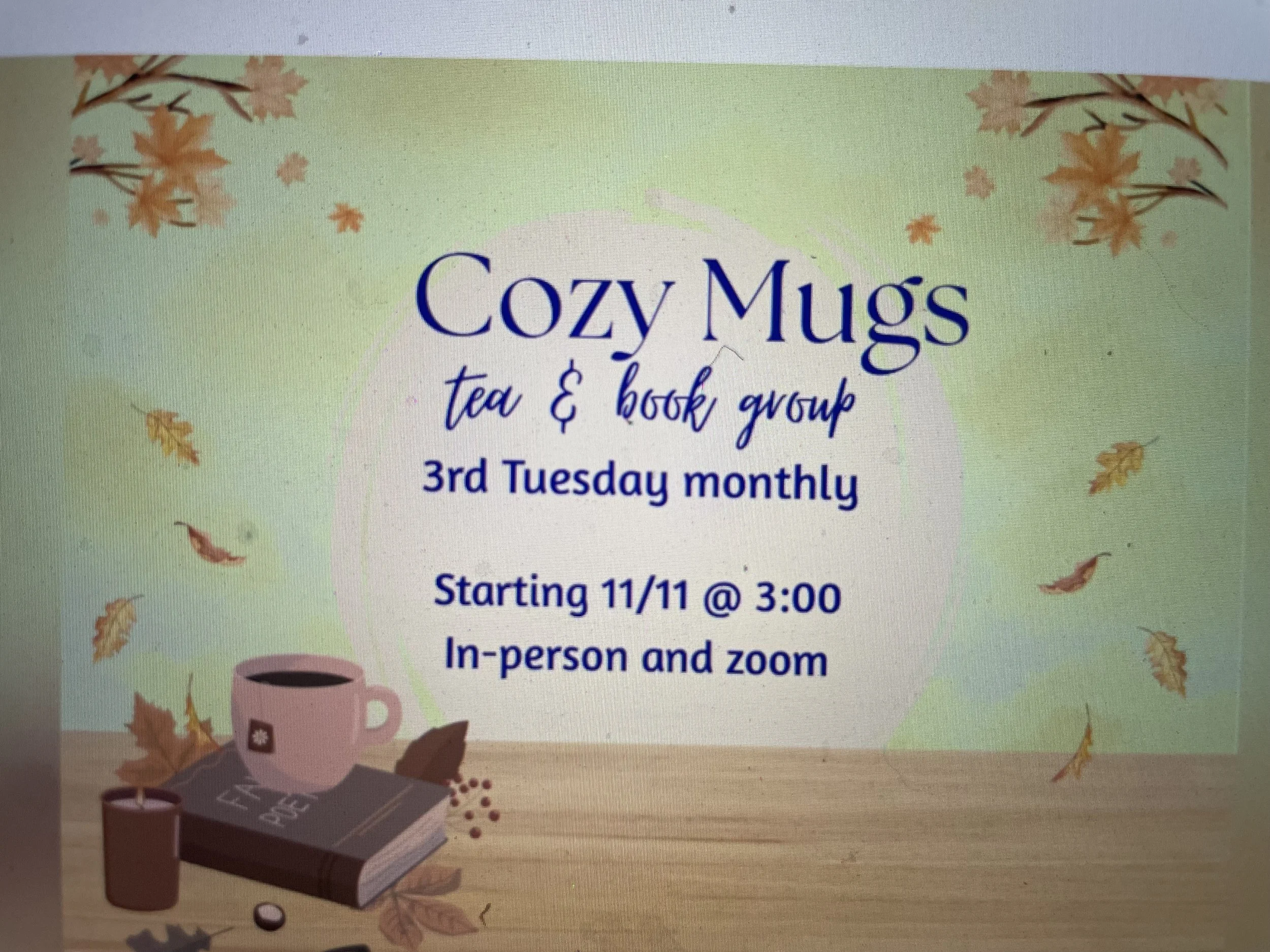 Flyer for a cozy mugs tea and book group meeting on the 3rd Tuesday of each month at 3:00, with autumn leaves and a steaming mug graphic in the background.