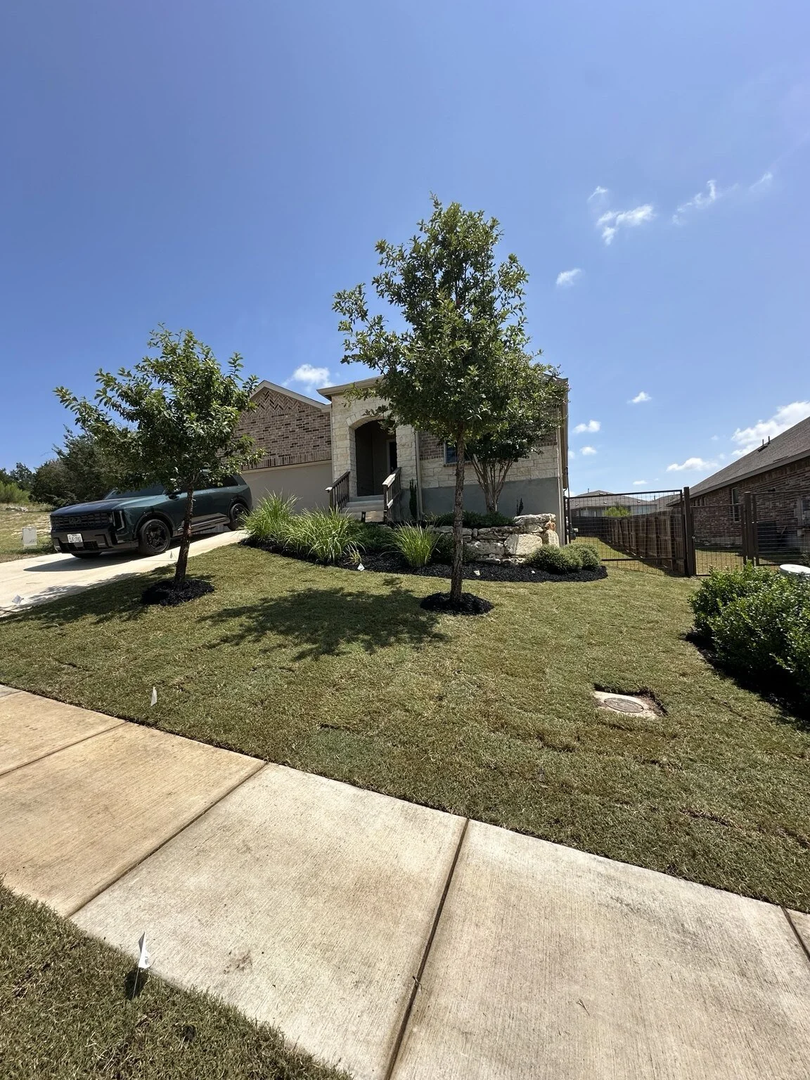 Completed Cutitzero sod installation in a San Antonio front yard