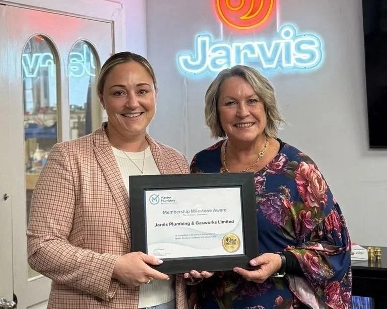 The Jarvis family celebrated 40 years as certified Master Plumbers in 2025. In this image, Rhiannon and Genny Jarvis show off the Master Plumbers milestone certificate together.