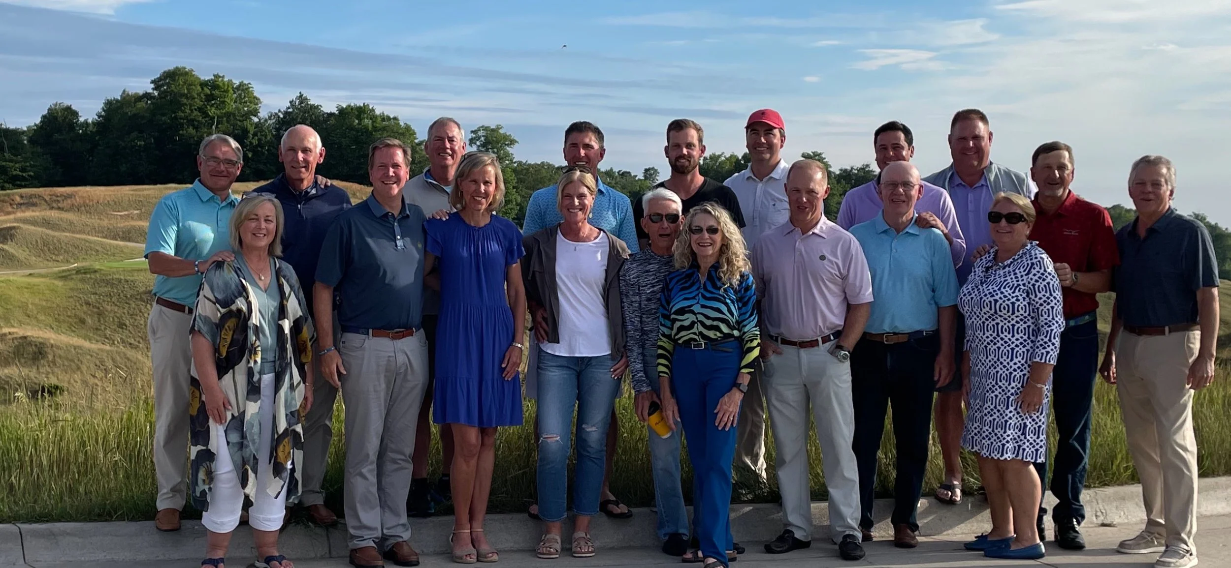 Donor event guests posing for a group photo under sunny skies – celebrating community, generosity, and shared moments on the golf course.
