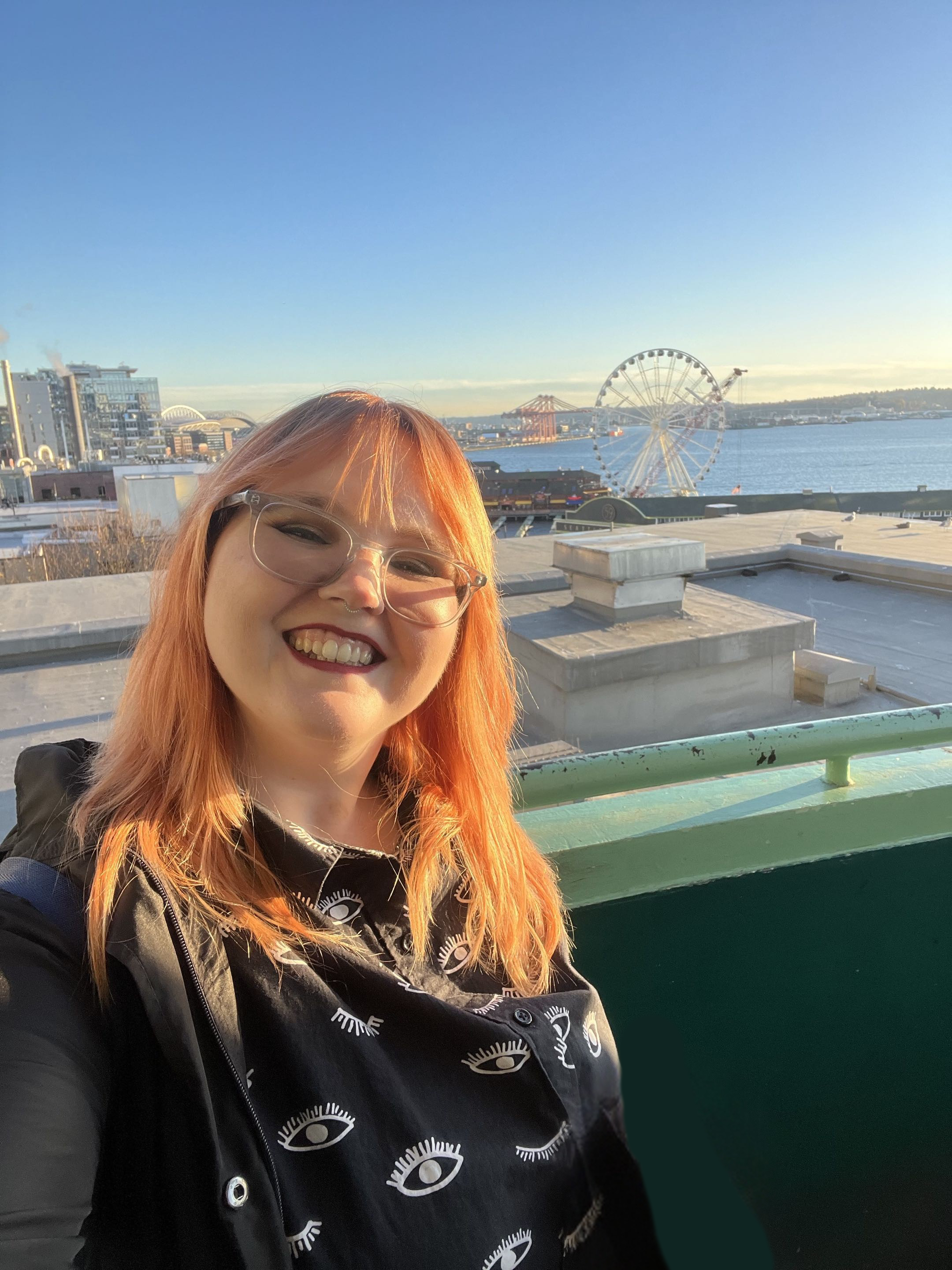 Breeanna at sunset standing in front of the Seattle ferris wheel.