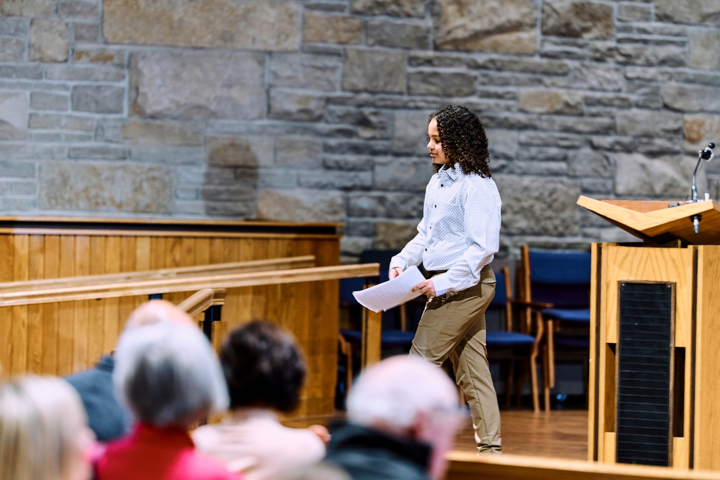 Eli smiling as he walks off stage after performing at the 2026 Naji Piano School recital.