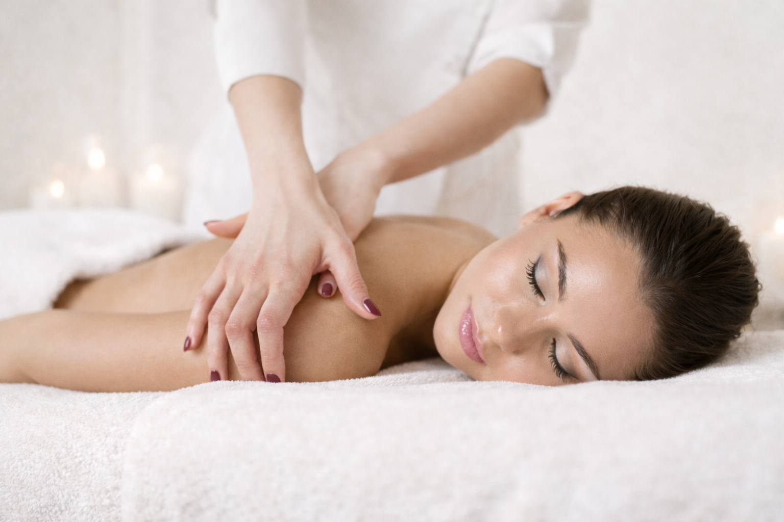 Relaxing massage session in a treatment room.