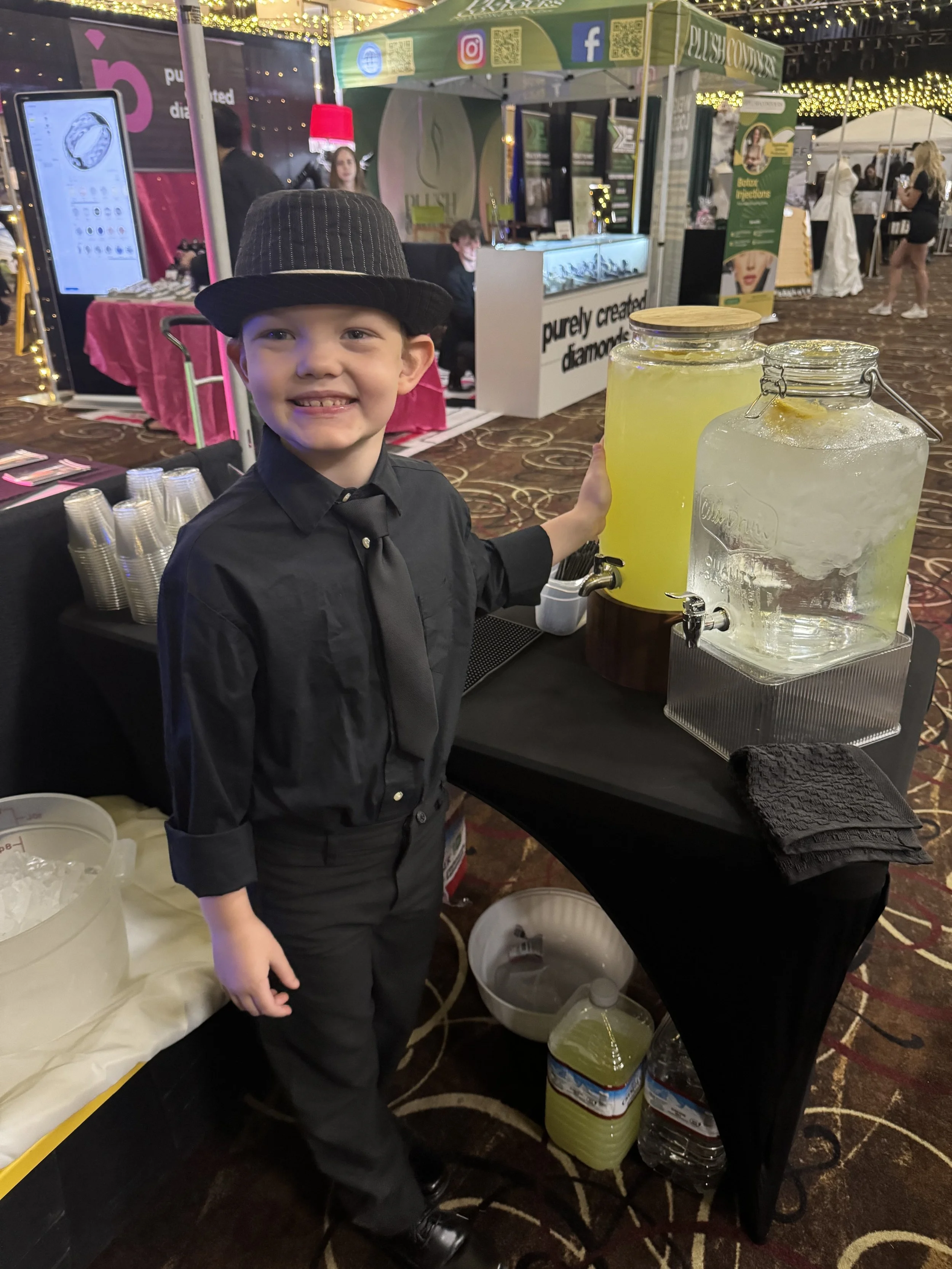 Talon working the lemonade stand at the Bridal show