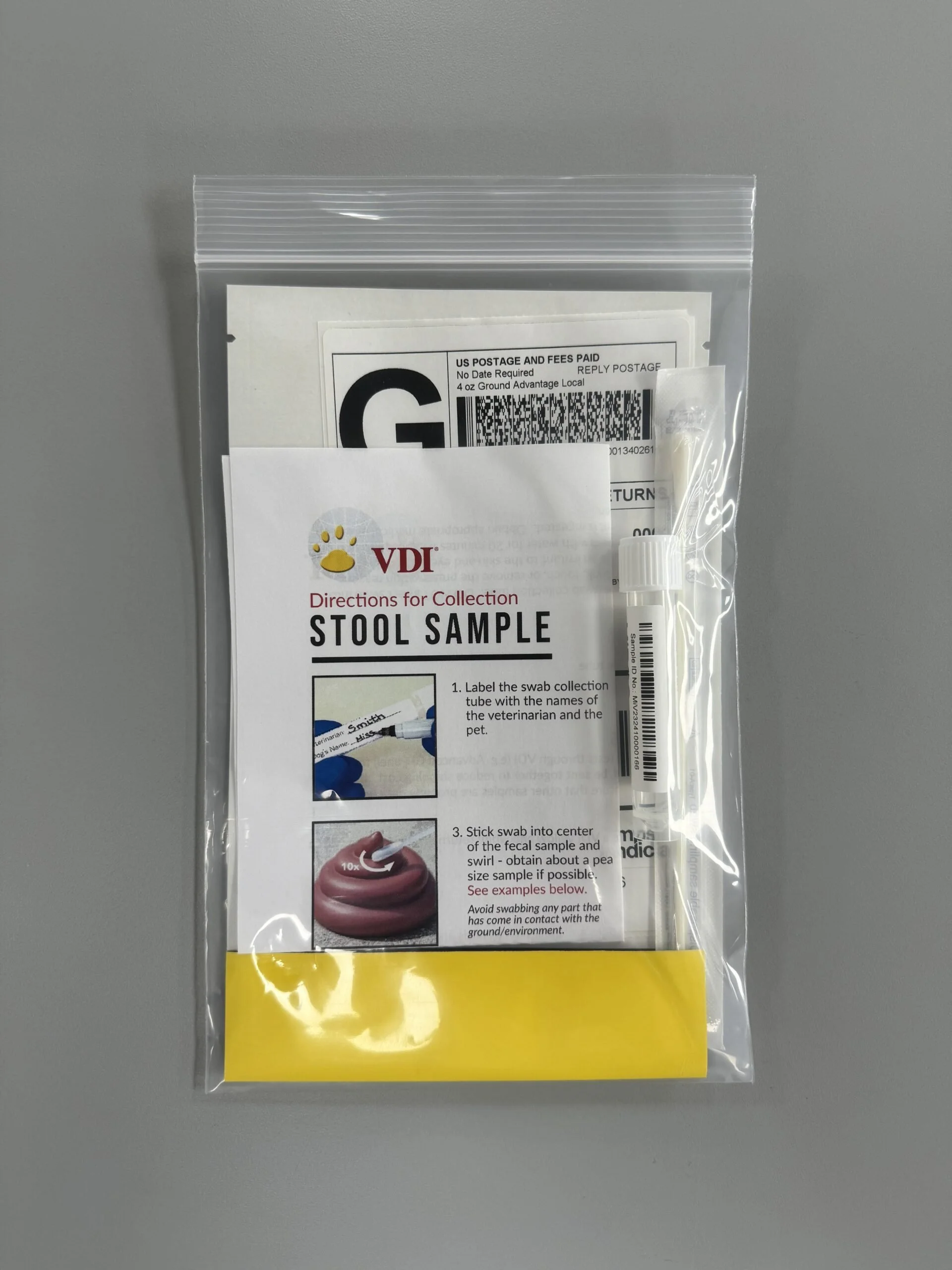Laboratory test tubes or vials in a rack, some with barcodes and labels, used for chemical or biological testing.