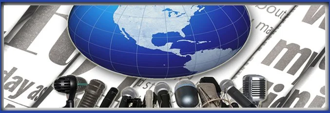 A globe showing North America and Central America, surrounded by multiple microphones, with a background of newspapers and partial world map.