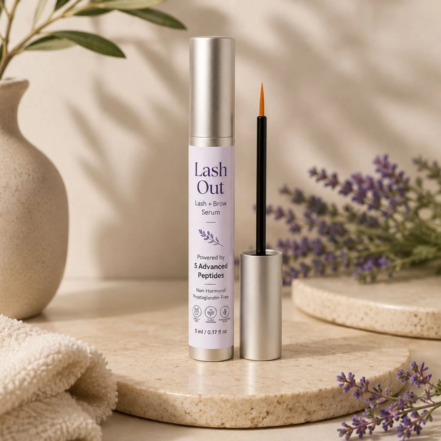 Lash Out lash serum front view standing with applicator.jpg