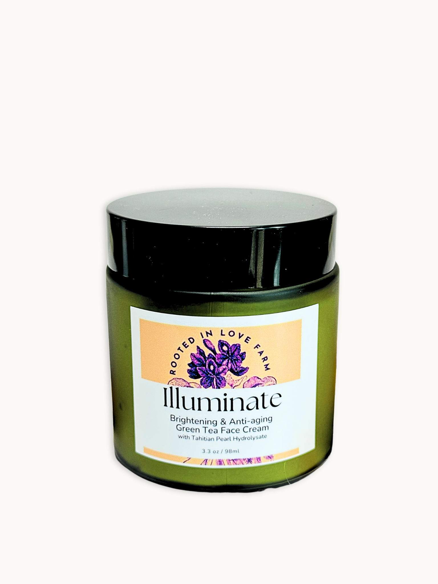 Product image of Illuminate Green Tea Face Cream in glass jar with black lid