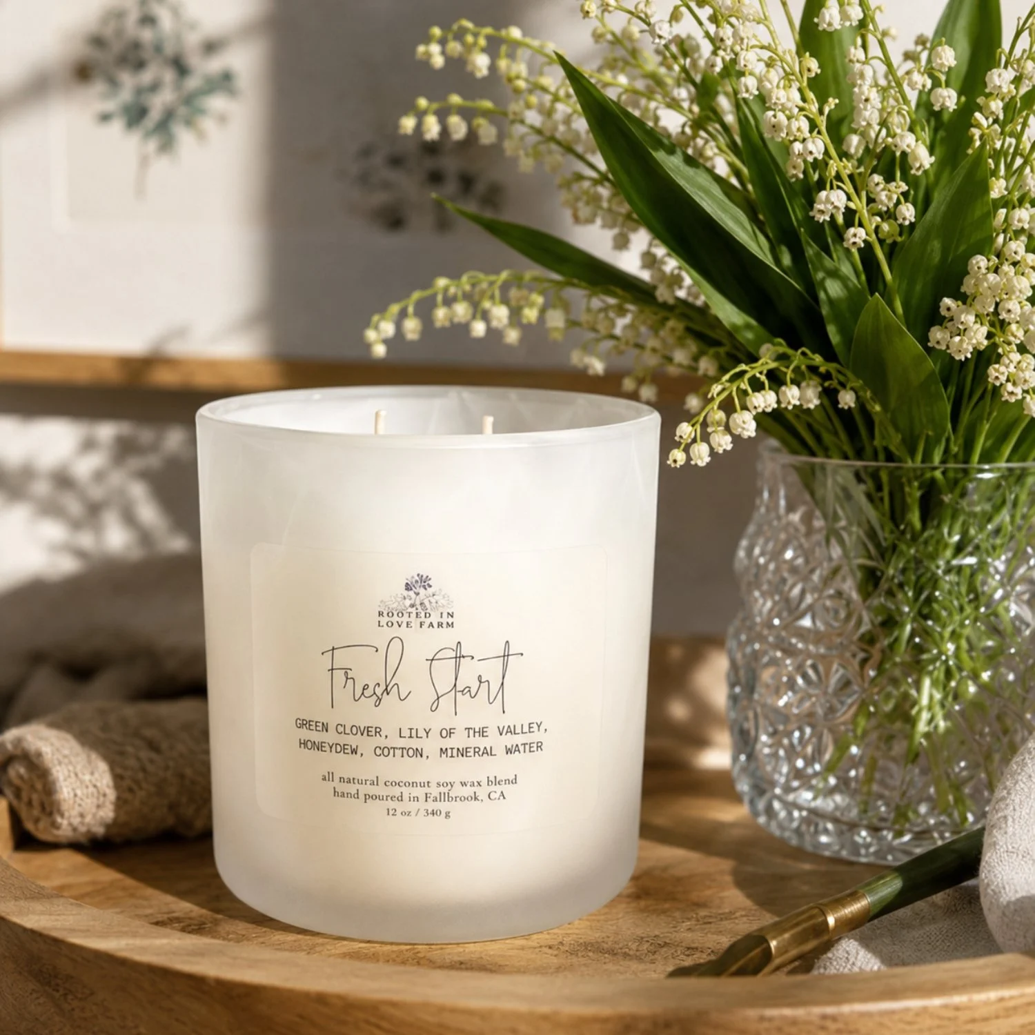 Fresh Start 12 oz next to lily of the valley.jpg